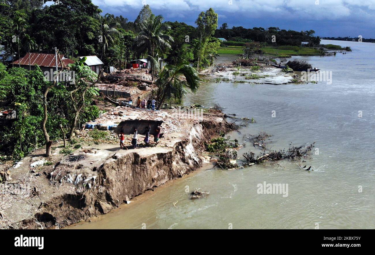 A view of a damaged village due the river erosion in Kharagandhi, Bangladesh, on August 16, 2020. Many villagers have lost their home, land, and livelihood due the natural disaster. The villagers claimed no authority of government came to rescue or help them in this situation. (Photo by Sony Ramany/NurPhoto) Stock Photo