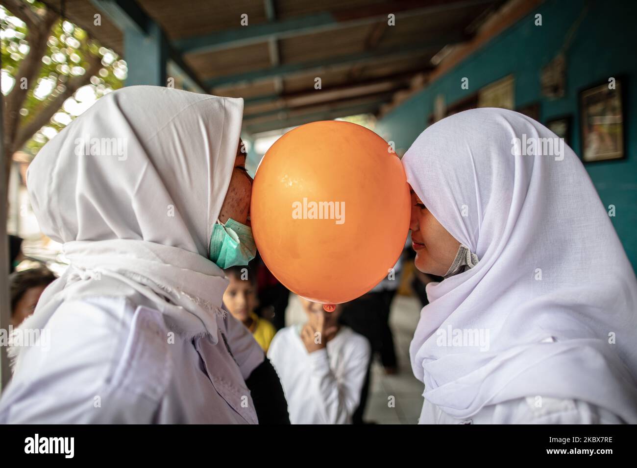 People at South Tangerang Held Games to celebrate 75th Independence Day in Banten, Indonesia, on August 17, 2020. KBR Pencak Silat Organization at Pamulang Held the Pencak Silat Martial Art Performance, Eating Kerupuk race, and puth nail into bottle race in celebrating the independence day. During Pandemi situation people still held the independence day. (Photo by Donal Husni/NurPhoto) Stock Photo