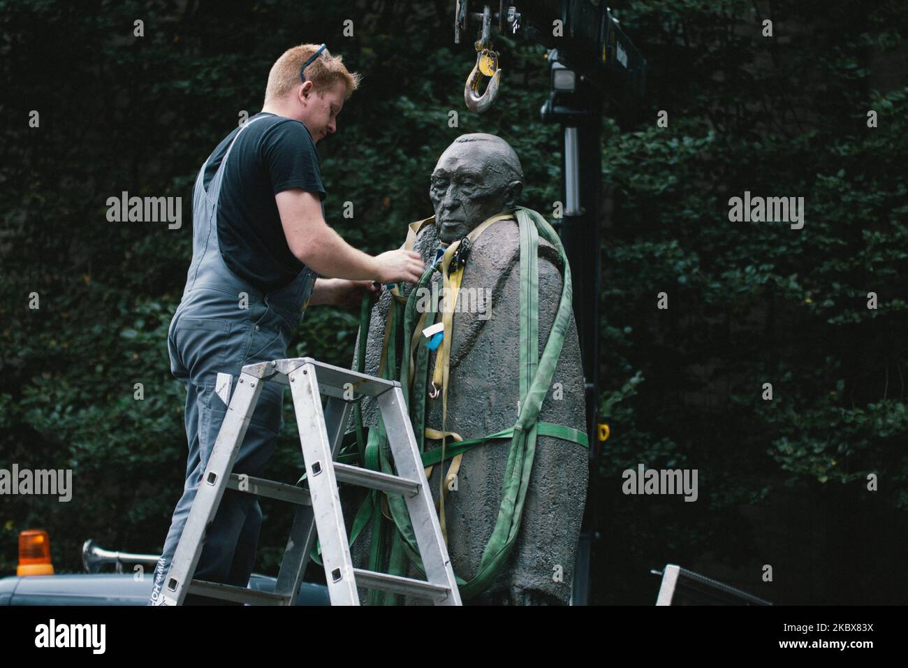 employees installs the Konrad Adenauer statue i in front of St. Aposteln in Cologne, Germany, on August 17, 2020. (Photo by Ying Tang/NurPhoto) Stock Photo