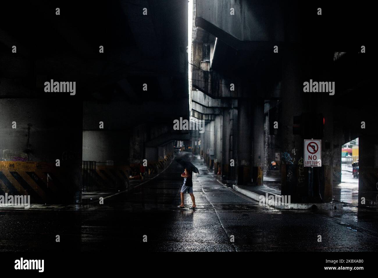A man crosses a road in Quezon City, Philippines on August 19, 2020