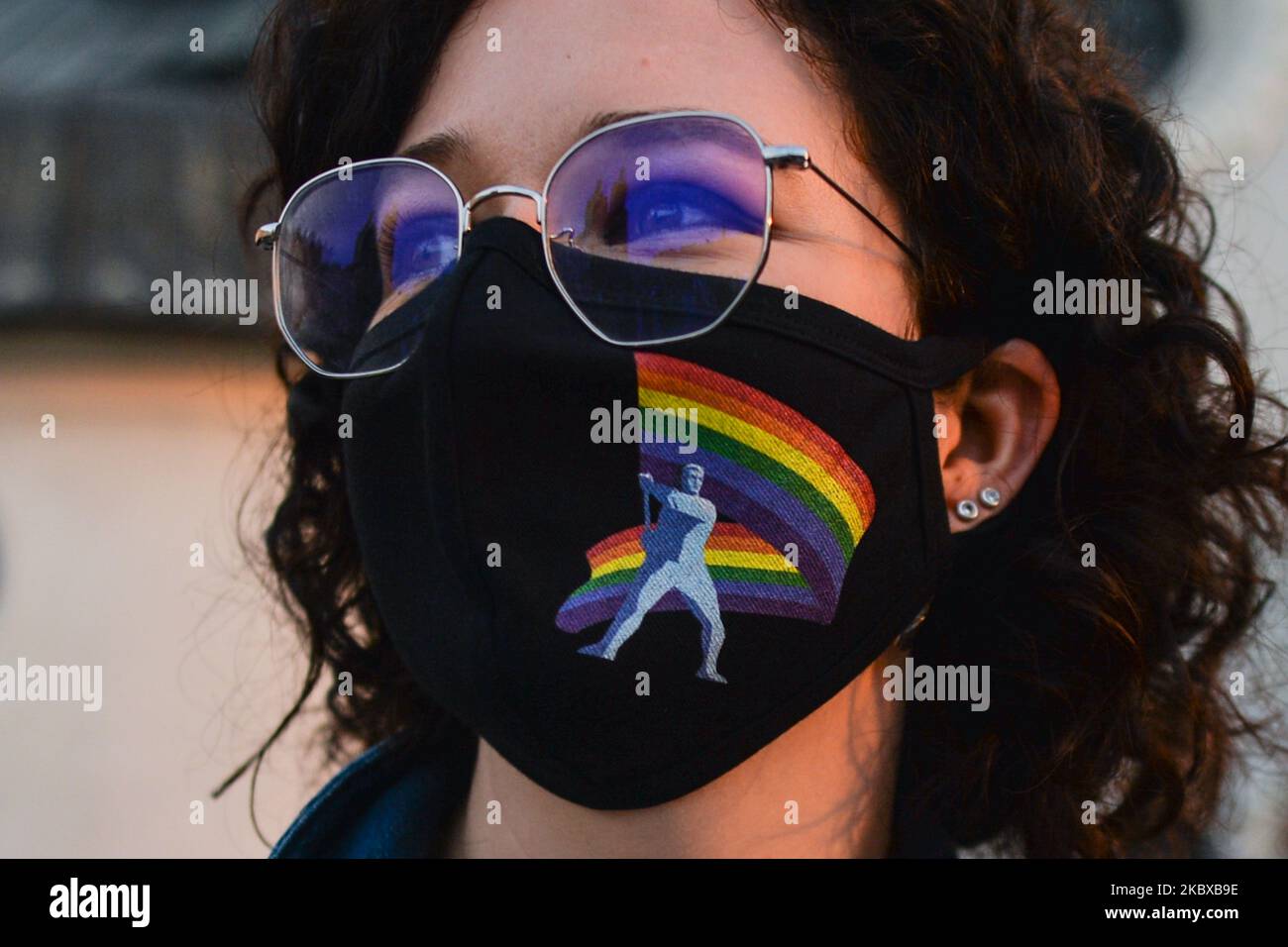 A pro-LGBT protester wearing a protective mask. Far Right nationalists and Pro-Life activists organised a protest against the LGBT next to the Adam Mickiewicz monument in Krakow's Main Market Square. On the opposite side of the square, LGBT activists and antifascists organised a counter protest. On August 19, 2020, in Krakow, lesser Poland Voivodeship, Poland. (Photo by Artur Widak/NurPhoto) Stock Photo