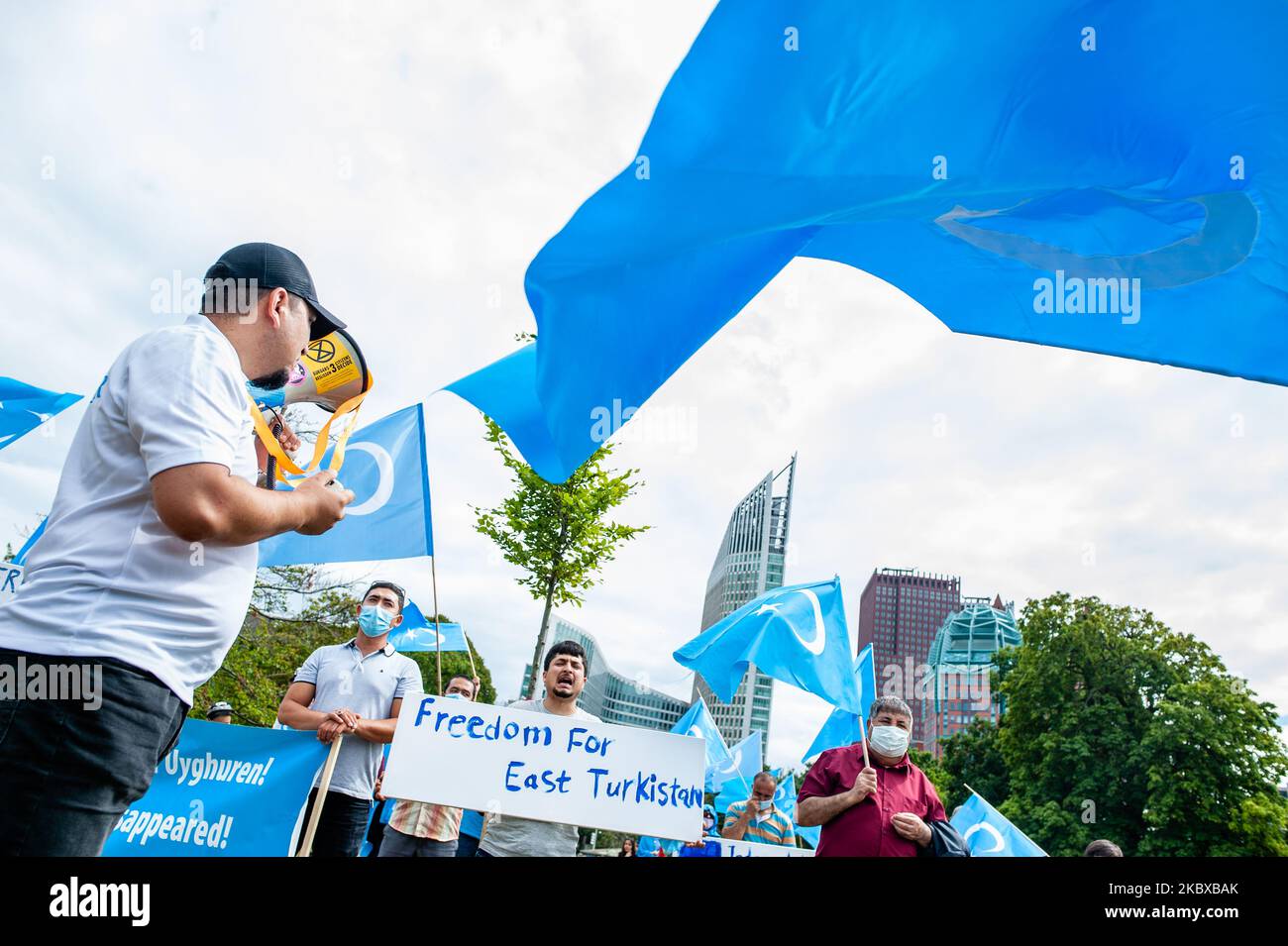 A group of Uyghurs are holding placards, and Uyghur flags, during the demonstration 'Freedom for Uyghurs' in The Hague, Netherlands on August 20th, 2020. (Photo by Romy Arroyo Fernandez/NurPhoto) Stock Photo
