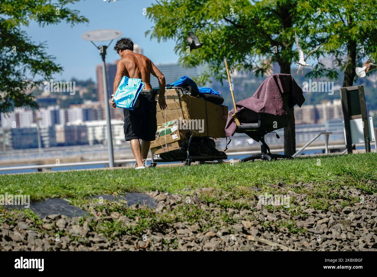 A homeless person is seen at Hudson River Park as New York City continues Phase 4 of re-opening following restrictions imposed to slow the spread of coronavirus on August 20, 2020 in New York City. The fourth phase allows outdoor arts and entertainment, sporting events without fans and media production. NYC Slashes Funding For Parks Department, Fair Fares Program report says. (Photo by John Nacion/NurPhoto) Stock Photo