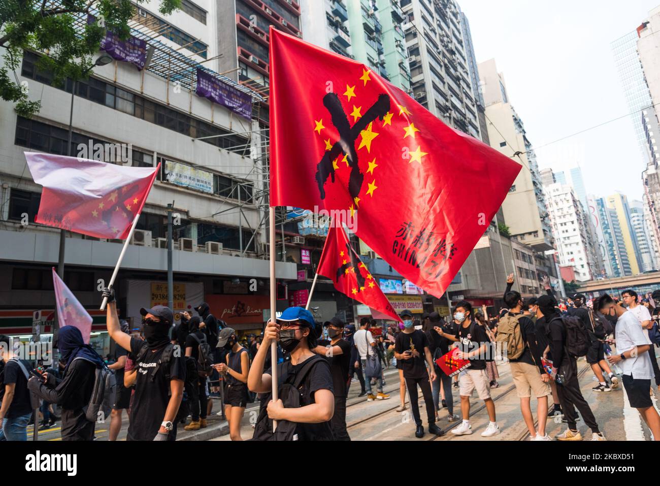 A protester marches with a "Chinazi" flag, associating the communist stars  of the Chinese national flag to the form of the nazi swastikain Hong Kong,  China, on 29 Sep 2019. (Photo by
