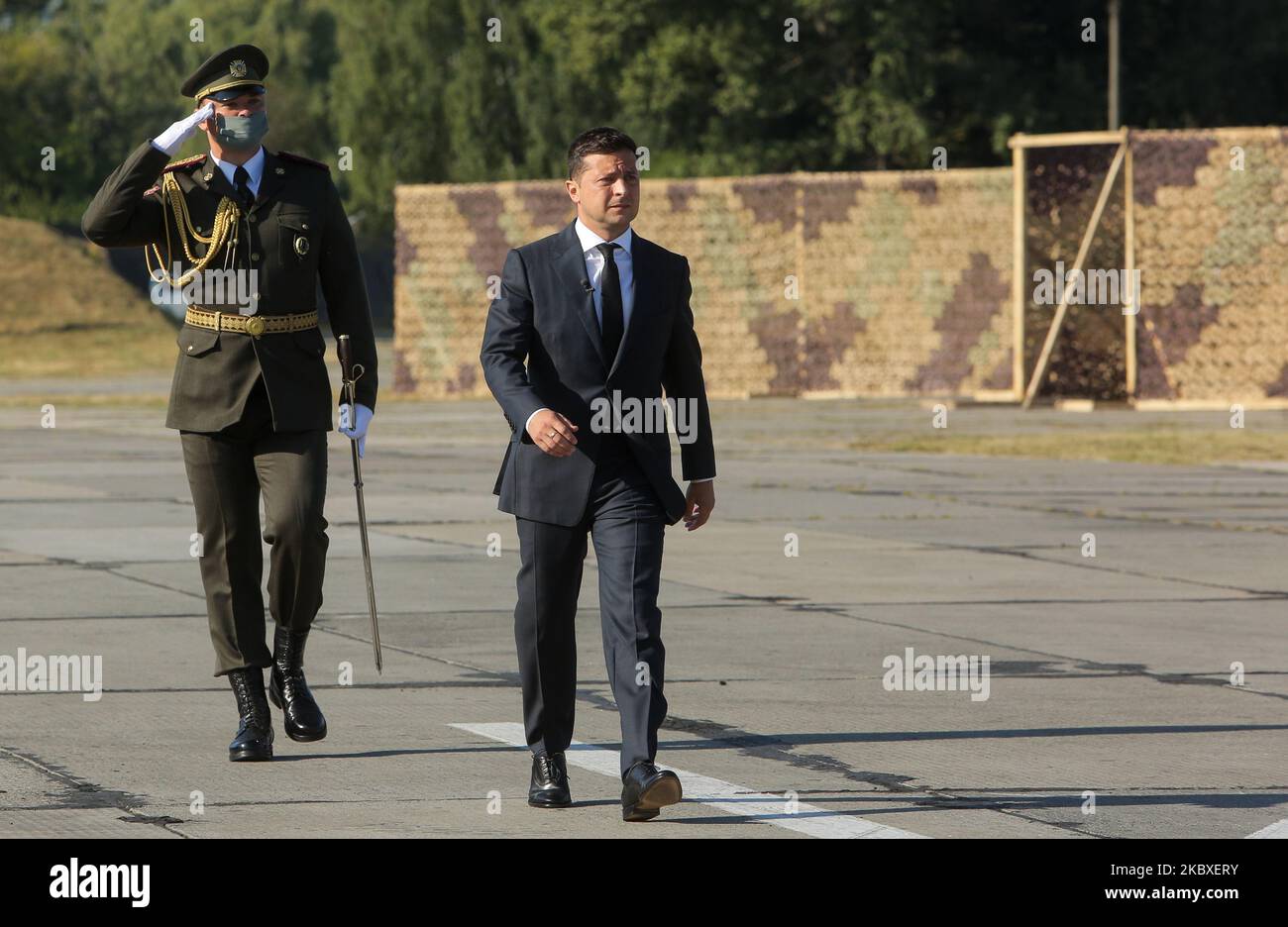 President Volodymyr Zelenskyy walks in front of lined up soldiers as he arrived at Vasylkiv military base near Kyiv, Ukraine, August 23, 2020. Ukraine celebrates The National Flag Day. State authorities visit military base. (Photo by Sergii Kharchenko/NurPhoto) Stock Photo