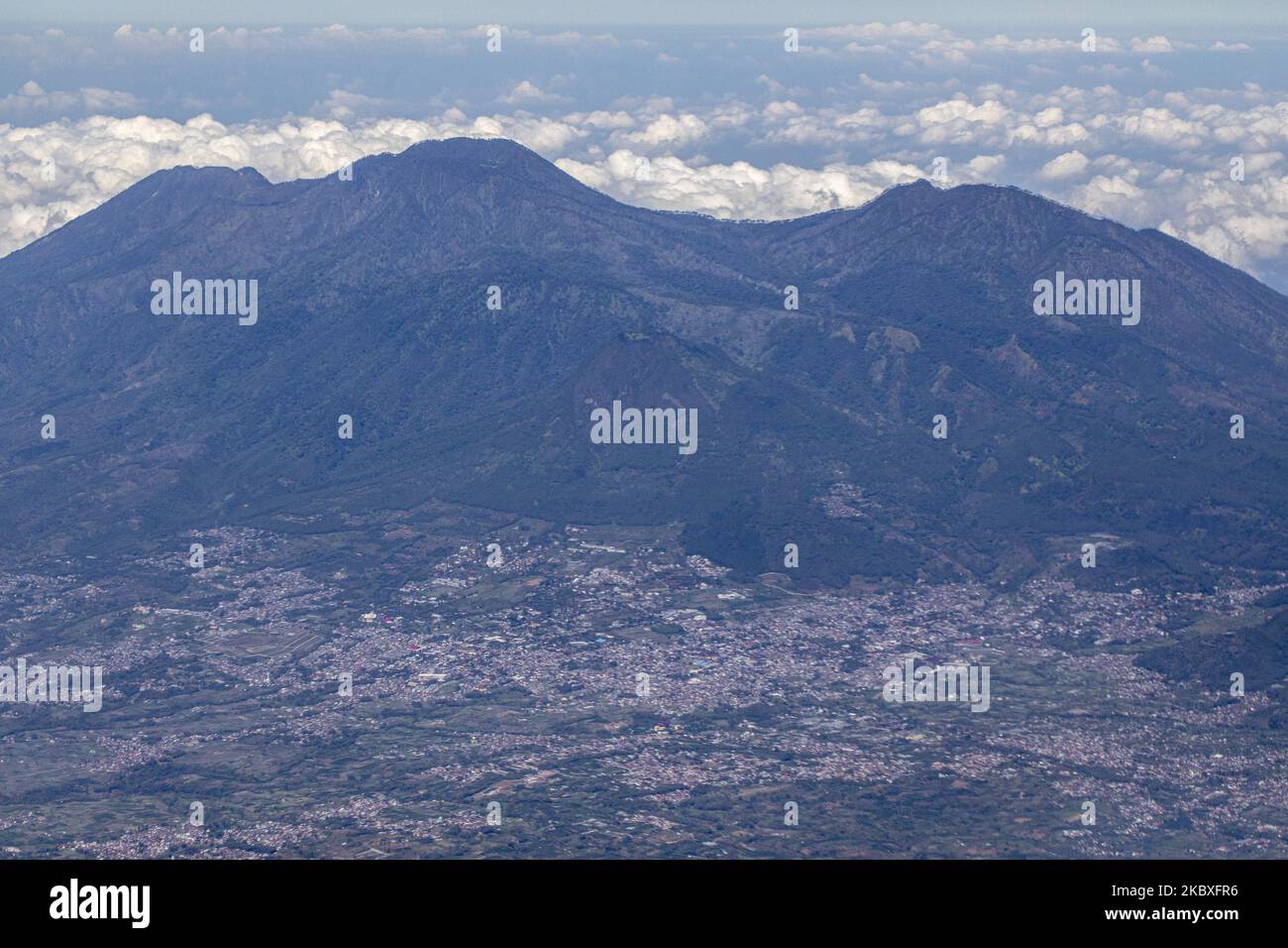 View of Mountail from an air plane in the sky at Java Island, Indonesia, on August 24, 2020. Indonesia have of total 139 active volcano the third largest country that have active volcano mountain. In Java Island there are 19 active volcano, one of them is Merapi Mountain at Yogyakarta that erupted in 2020. Beside of Pandemi situation that hit the country, Indonesia also facing the huge allert of disaster if all the active volcano erupted. (Photo by Donal Husni/NurPhoto) Stock Photo