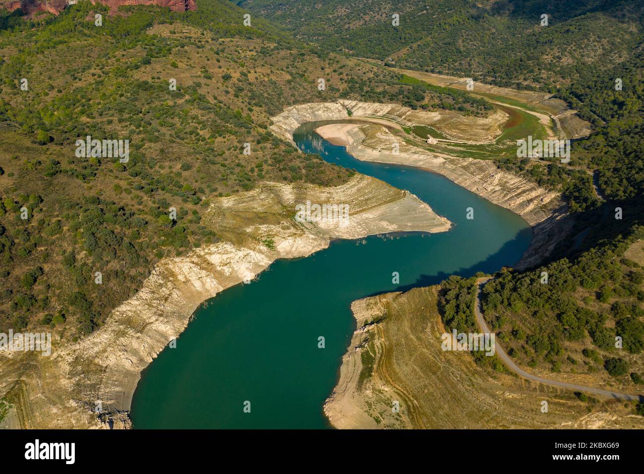 Aerial view of the almost dry Pantà de Siurana reservoir during the 2022 drought (Pirorat, Tarragona, Catalonia, Spain) Stock Photo