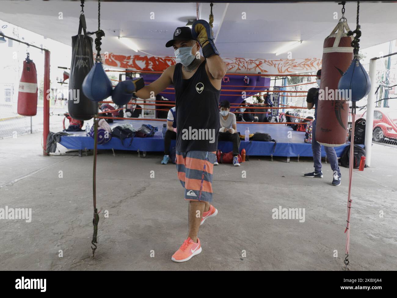 A man during boxing classes at the Team Curtidores Technical School of Boxing, which reopened its facilities located under a vehicular bridge in Coyoacán, Mexico City, during the health emergency due to COVID-19. (Photo by Gerardo Vieyra/NurPhoto) Stock Photo