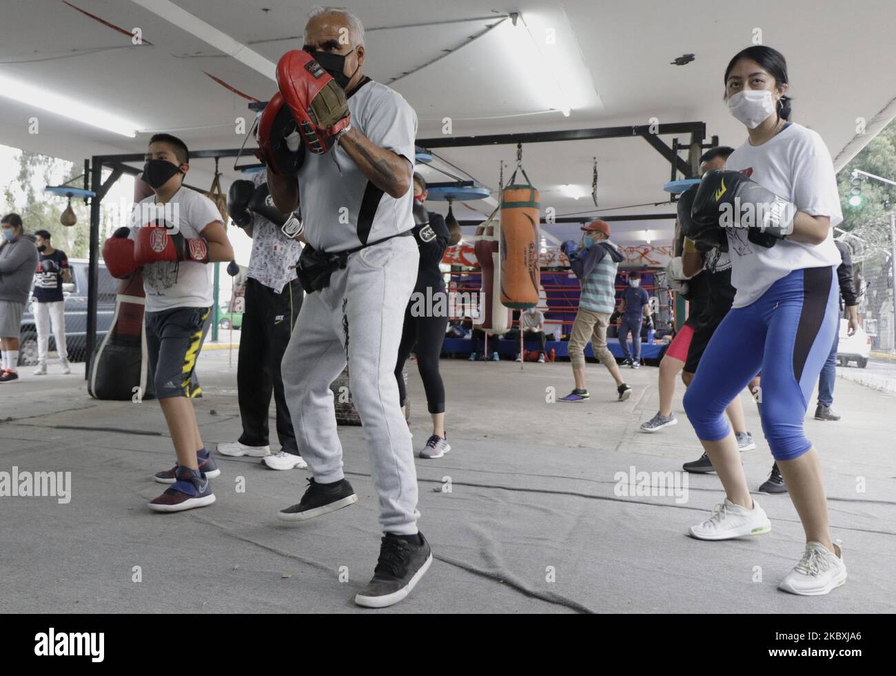 Boxing classes at the Team Curtidores Boxing Technical School, which reopened its facilities located under a vehicular bridge in Coyoacán, Mexico City, during the health emergency due to COVID-19. (Photo by Gerardo Vieyra/NurPhoto) Stock Photo