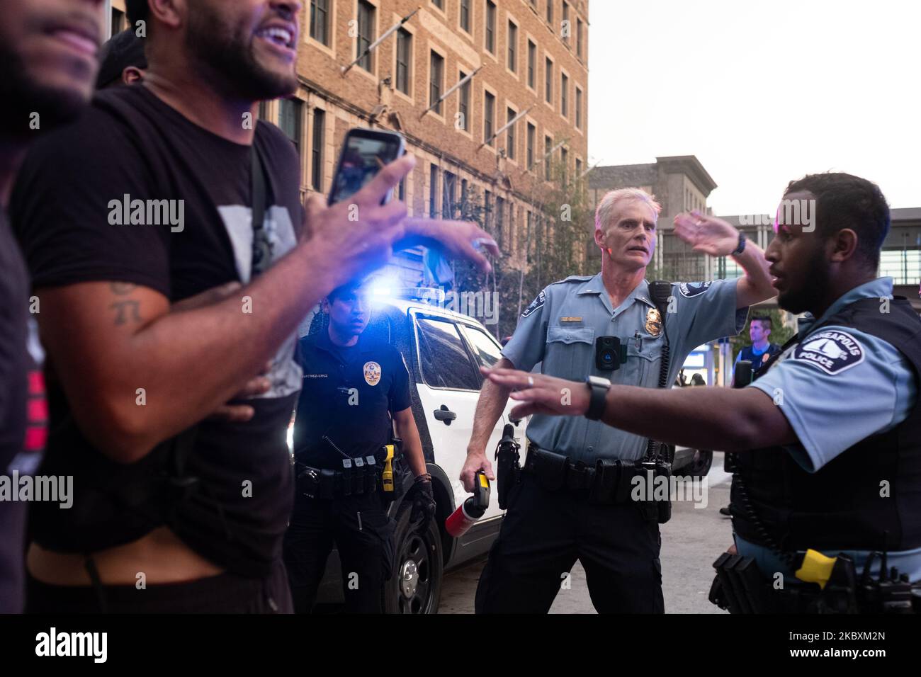 Officers try to hold their position as residents and protesters accuse ...