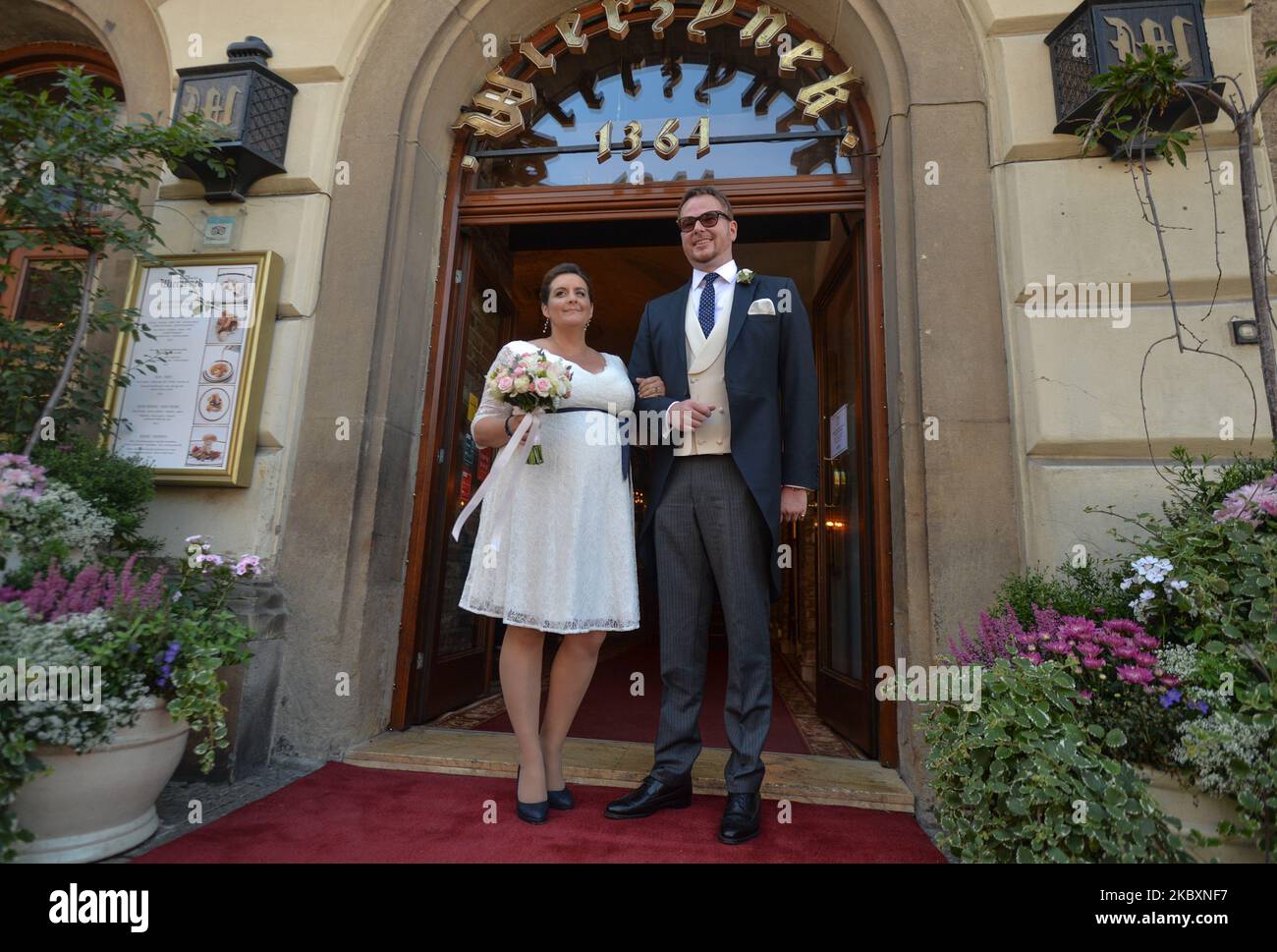 Prince Jan Lubomirski-Lanckoronski and Countess Helena Mankowska pose for a picture outside the entrance to 'Wierzynek' restaurant in Krakow's Main Market Square. Jan Lubomirski-Lanckoronski, who in 2019 was ranked 100th on the list of the '100 richest Poles' was previously married to a Polish businesswoman Dominika Kulczyk, the daughter of a billionaire businessman Jan Kulczyk. They divorced in 2013 after 12 years of marriage. They had two children, Jeremy and Weronika. Due to the coronavirus pandemic, only a handful of closest relatives attended the ceremony. On Friday, August 28, 2020, in K Stock Photo