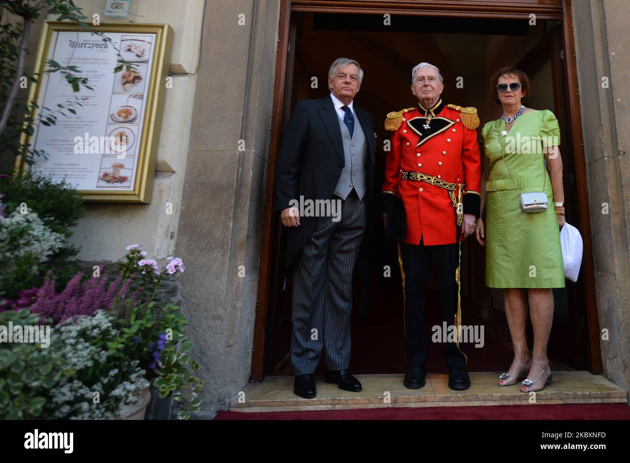 (L-R) Andrzej Maria Jozef Mankowski (bride's father), Prince Stanislaw Stefan Lubomirski-Lanckoronski and Ewa Maria Tarnawiecka (groom's parents) pose for a picture outside the entrance to 'Wierzynek' restaurant in Krakow', after the wedding ceremony of Prince Jan Lubomirski-Lanckoronski and Countess Helena Mankowska. Jan Lubomirski-Lanckoronski, who in 2019 was ranked 100th on the list of the '100 richest Poles' was previously married to a Polish businesswoman Dominika Kulczyk, the daughter of a billionaire businessman Jan Kulczyk. They divorced in 2013 after 12 years of marriage. They had tw Stock Photo