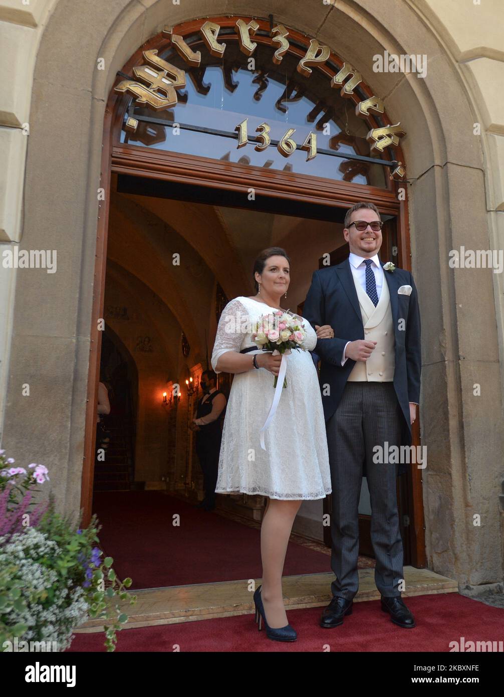 Prince Jan Lubomirski-Lanckoronski and Countess Helena Mankowska pose for a picture outside the entrance to 'Wierzynek' restaurant in Krakow's Main Market Square. Jan Lubomirski-Lanckoronski, who in 2019 was ranked 100th on the list of the '100 richest Poles' was previously married to a Polish businesswoman Dominika Kulczyk, the daughter of a billionaire businessman Jan Kulczyk. They divorced in 2013 after 12 years of marriage. They had two children, Jeremy and Weronika. Due to the coronavirus pandemic, only a handful of closest relatives attended the ceremony. On Friday, August 28, 2020, in K Stock Photo