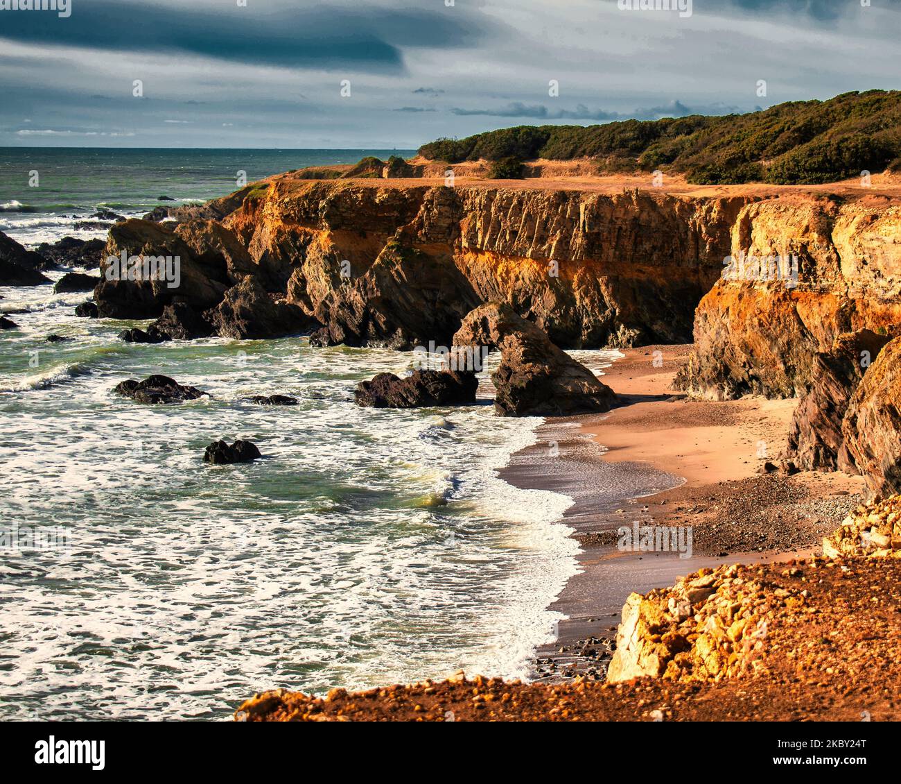 A view of the sea waves hitting the rocky coast Stock Photo - Alamy