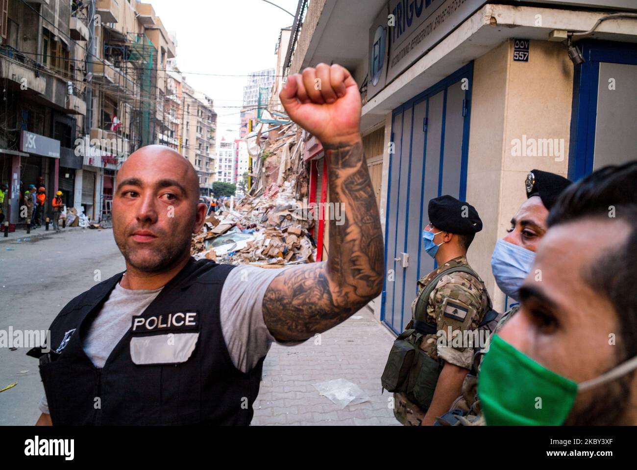 Lebanese policeman emerge the people that they have gathered to 