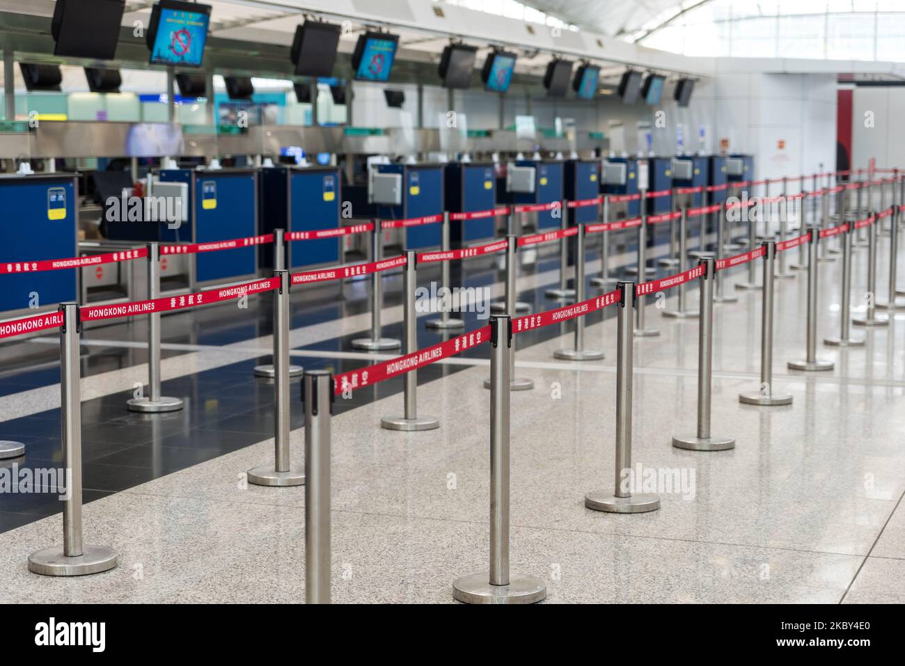 Empty check-in lines at Hong Kong Airport, China, on September 4, 2020. Once a hub of air travel in Asia, the pandemic has hit hard Hong Kong International airport, where air traffic is only a trickle of the pre-Covid times and where quarantine restrictions restrain residents from entering the city easily. Despite this, the service quality of Hong Kong airport's staff remains unparalleled, with very professional support to passengers, despite the minimalist settings. (Photo by Marc Fernandes/NurPhoto) Stock Photo