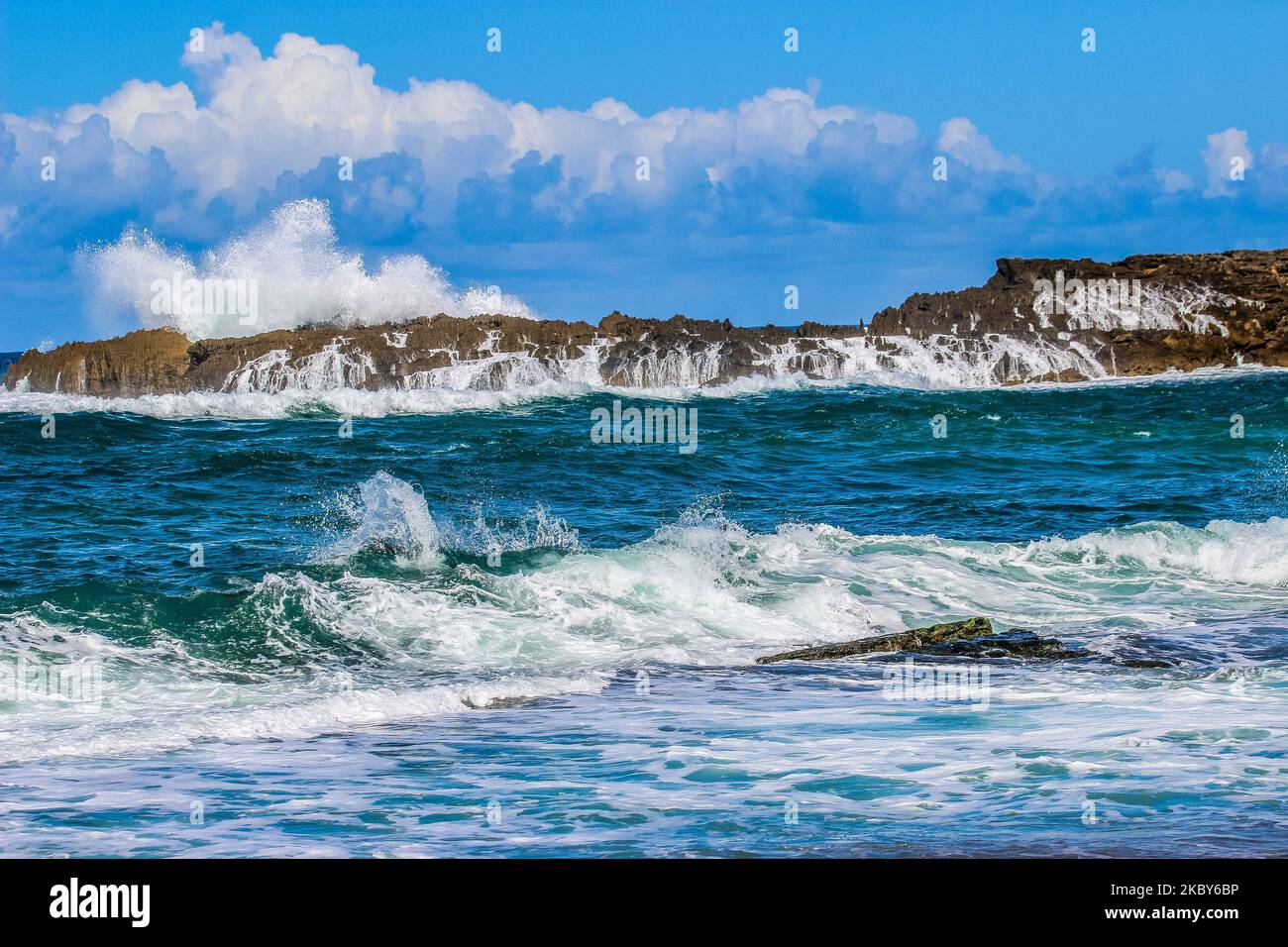 A beautiful beach view under cloudy blue sky Stock Photo - Alamy
