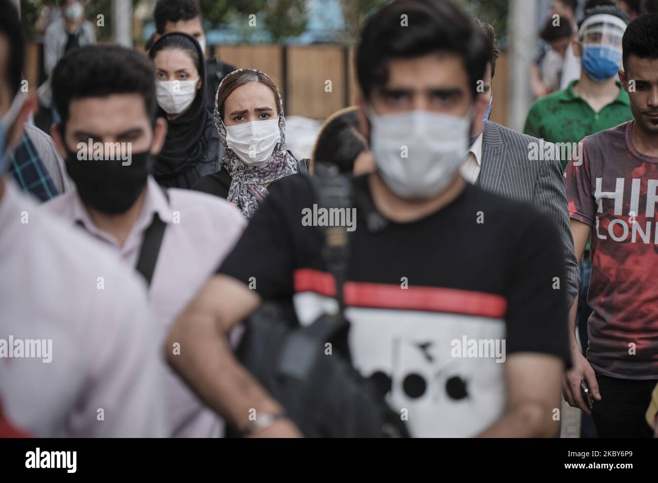 An Iranian woman wearing a protective face mask walks along an avenue in Tehran’s business district amid the new coronavirus (COVID-19) disease outbreak in Iran, on July 5, 2020. (Photo by Morteza Nikoubazl/NurPhoto) Stock Photo