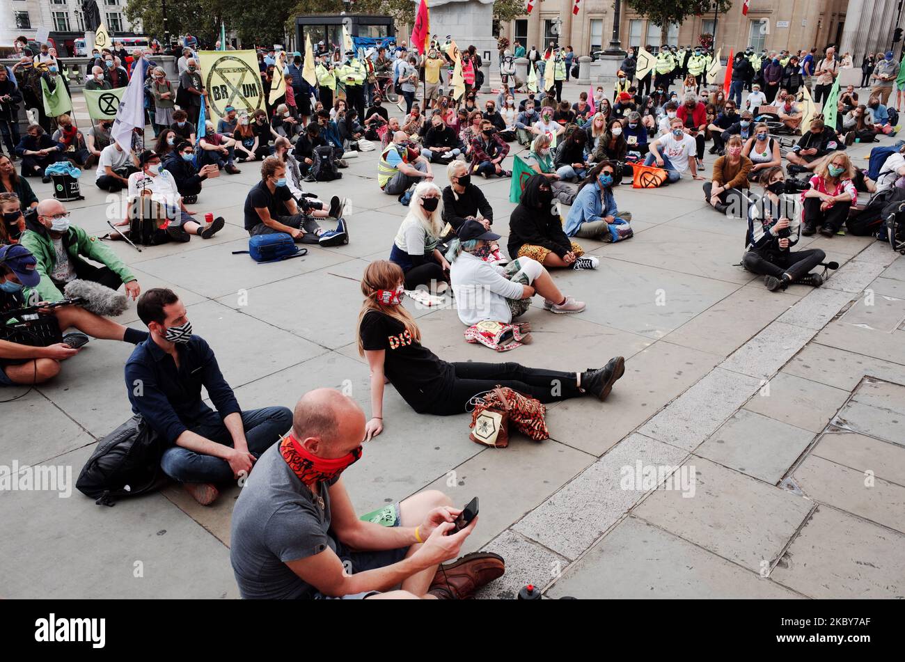 Members of climate change activist movement Extinction Rebellion take part in a 'people's assembly' staged by the group in Trafalgar Square in London, England, on September 5, 2020. The event was later broken up by police under coronavirus powers that limit gatherings to just 30 people, with some activists arrested for refusing to disperse. (Photo by David Cliff/NurPhoto) Stock Photo