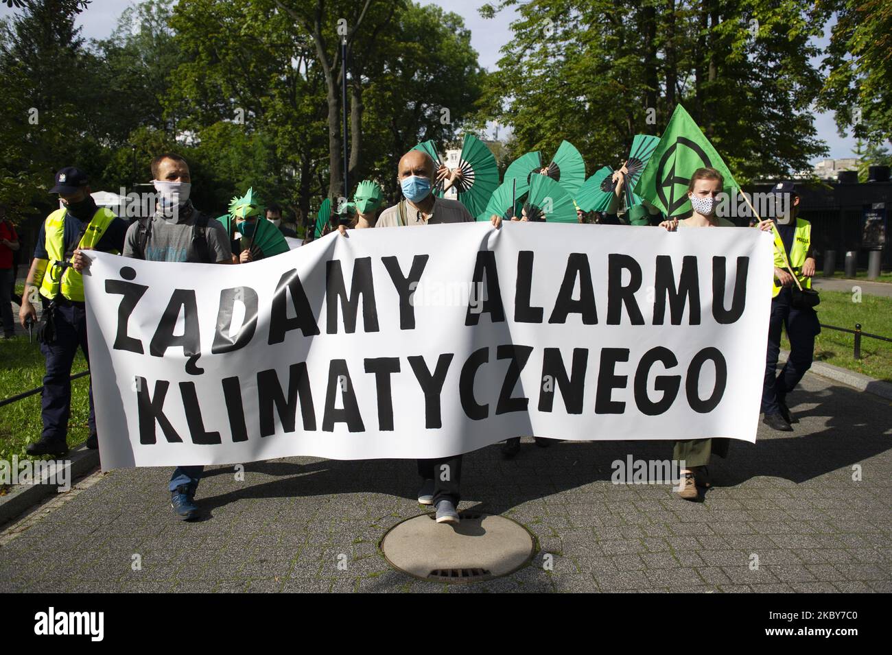 Demonstrators hold a banner that reads 'We demand climatic alarm' on September 5, 2020 in Warsaw, Poland. A few thousand people took the streets in the great march for climate organised by Extinction Rebellion as the start of the climate protests season to demand immediate action from the politics and to raise awareness about climate changes. (Photo by Aleksander Kalka/NurPhoto) Stock Photo