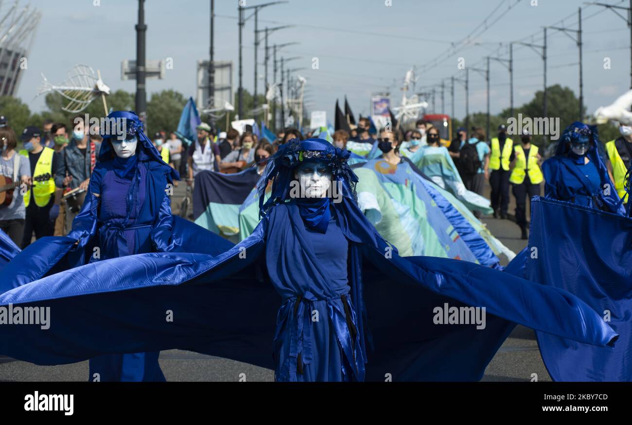 Extinction Rebellion activists dressed in blue gown are seen ahead of the great march for climate on September 5, 2020 in Warsaw, Poland. A few thousand people took the streets in the great march for climate organised by Extinction Rebellion as the start of the climate protests season to demand immediate action from the politics and to raise awareness about climate changes. (Photo by Aleksander Kalka/NurPhoto) Stock Photo