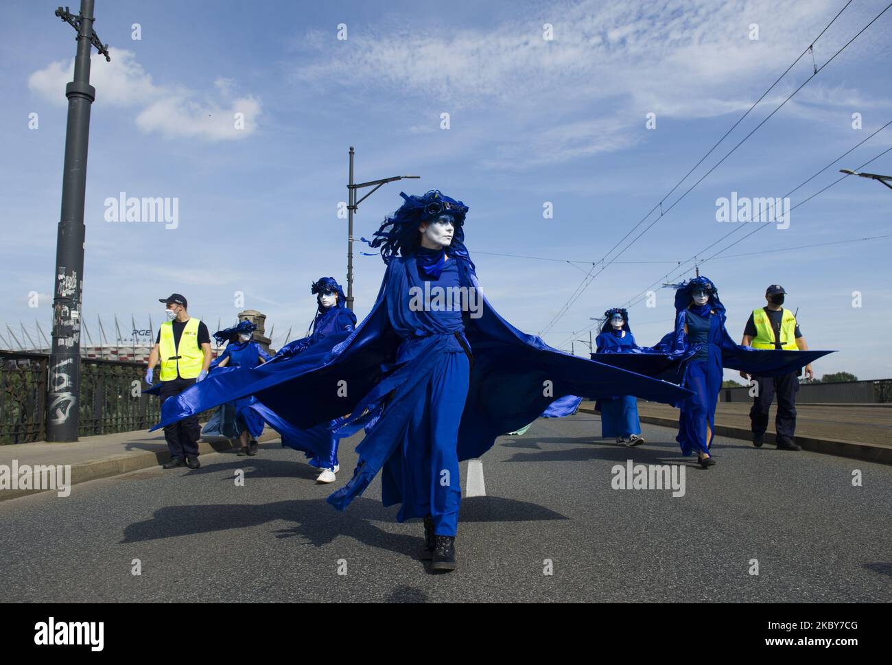 Extinction Rebellion activists dressed in blue gowns take part in the 'wave of sadnesses' during the great march for climate change on September 5, 2020 in Warsaw, Poland. A few thousand people took the streets in the great march for climate organised by Extinction Rebellion as the start of the climate protests season to demand immediate action from the politics and to raise awareness about climate changes. (Photo by Aleksander Kalka/NurPhoto) Stock Photo