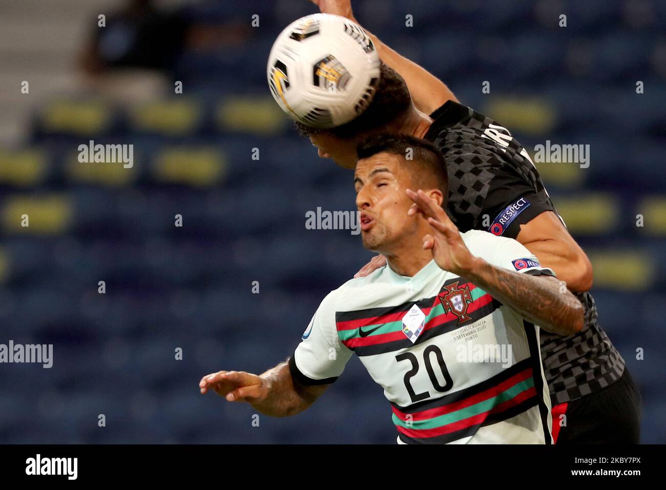 Joao Cancelo of Portugal heads the ball with Ivan Perisic of Croatia (top) during the UEFA Nations League group stage football match between Portugal and Croatia at the Dragao stadium in Porto, Portugal on September 5, 2020. (Photo by Pedro FiÃºza/NurPhoto) Stock Photo