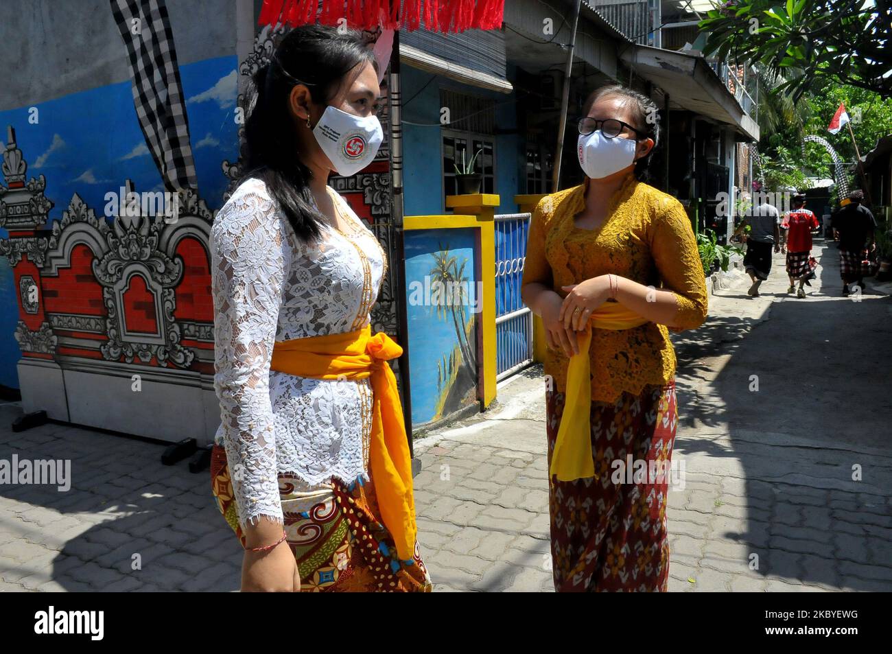 Activities of Balinese villagers during the pandemic in Harapan Jaya in Bekasi City, West Java, On September 9,2020. The existence of this village is thick with Bali culture, because the majority of residents in the neighborhood, 60 percent are Balinese. The advantage of this place is that it has the beauty and hydroponic plants that grow in almost every resident's house as well as the diversity of different beliefs, but still upholds community harmony where children can learn Bali art and it is open to guests who will learn art, besides that it looks like women wearing traditional clothes typ Stock Photo