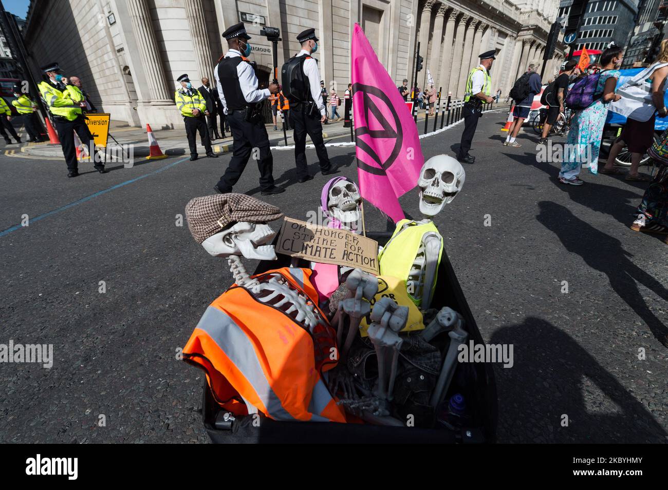 Three skeletons with a message saying 'On hunger strike for climate action' are seen during the Extinction Rebellion march through central London on the tenth and final day of mass protest action, on 10 September, 2020 in London, England. Extinction Rebellion carried out a series of disruptive actions over past ten days in a campaign to support the Climate and Ecological Emergency Bill, which would speed up the UK’s progress on reducing its carbon emissions, and hold a national citizens’ assembly on the crisis. (Photo by WIktor Szymanowicz/NurPhoto) Stock Photo