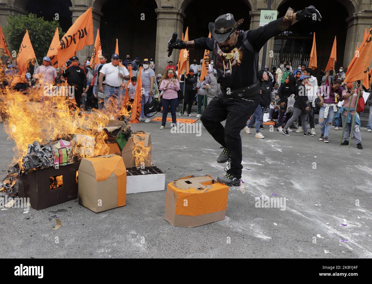Juan Colorado, the Supreme Commander of the Poor, set fire to and kicked cardboard boxes simulating houses of the Housing Institute of the capital, to demand justice and attention to people who were allegedly defrauded by shell companies and local authorities to process a housing loan in the Hangars area through this institute. On September 10, 2020 in Mexico City, Mexico. (Photo by Gerardo Vieyra/NurPhoto) Stock Photo