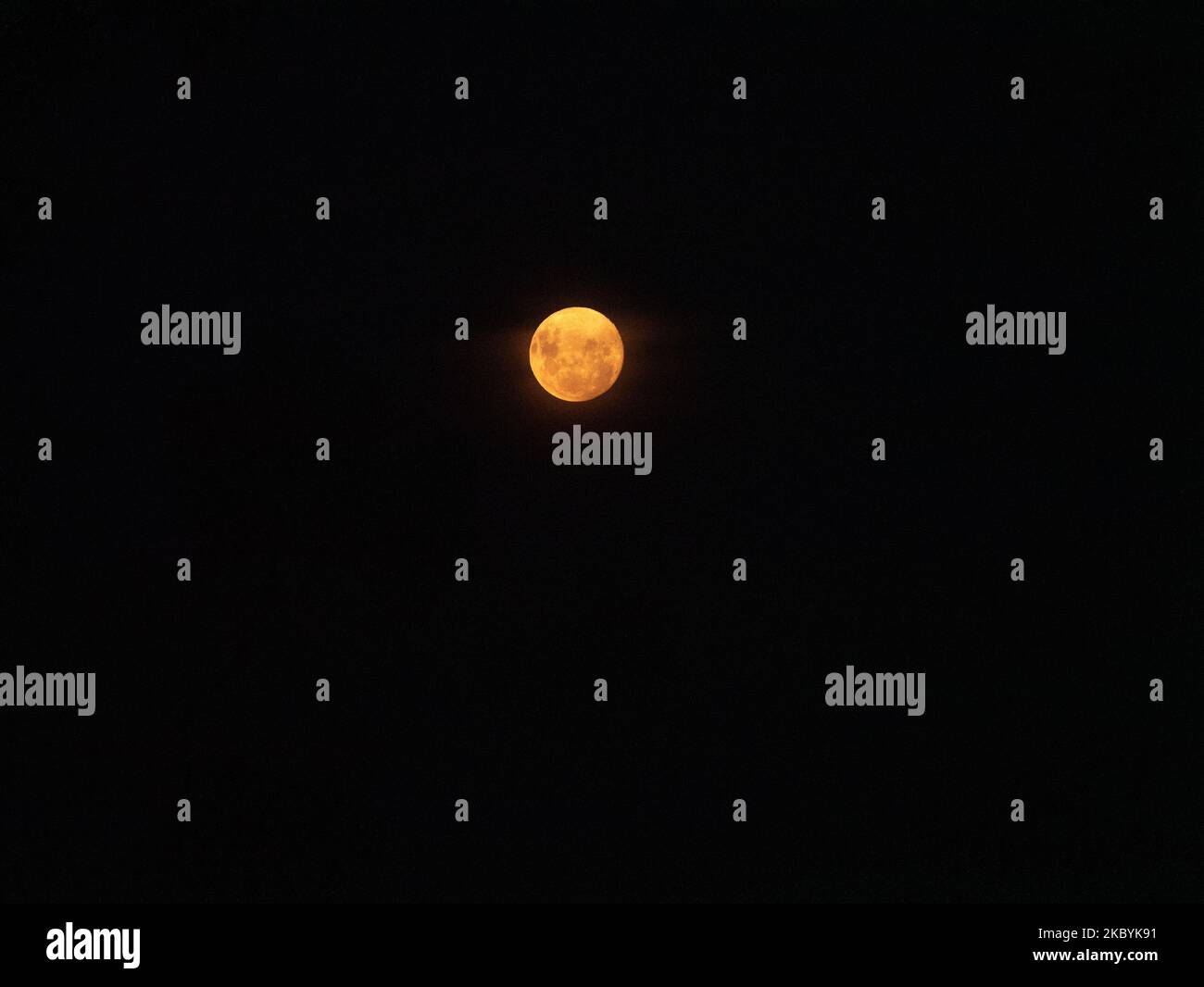 A golden full moon in the black sky, perfect for wallpaper Stock Photo ...