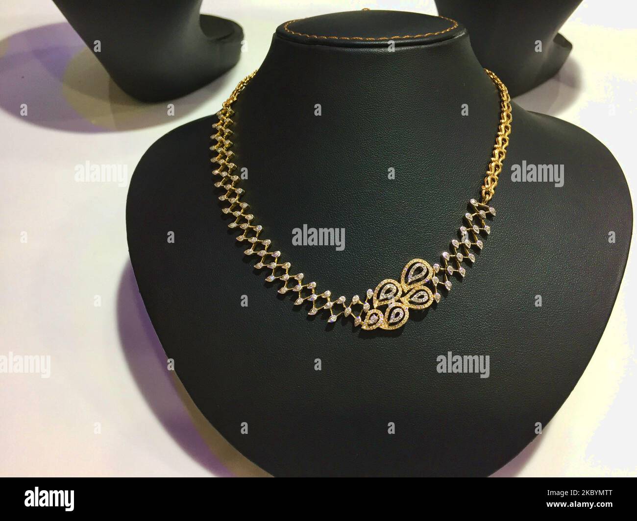 Gold and diamond necklace displayed at a jewelry shop in the city of