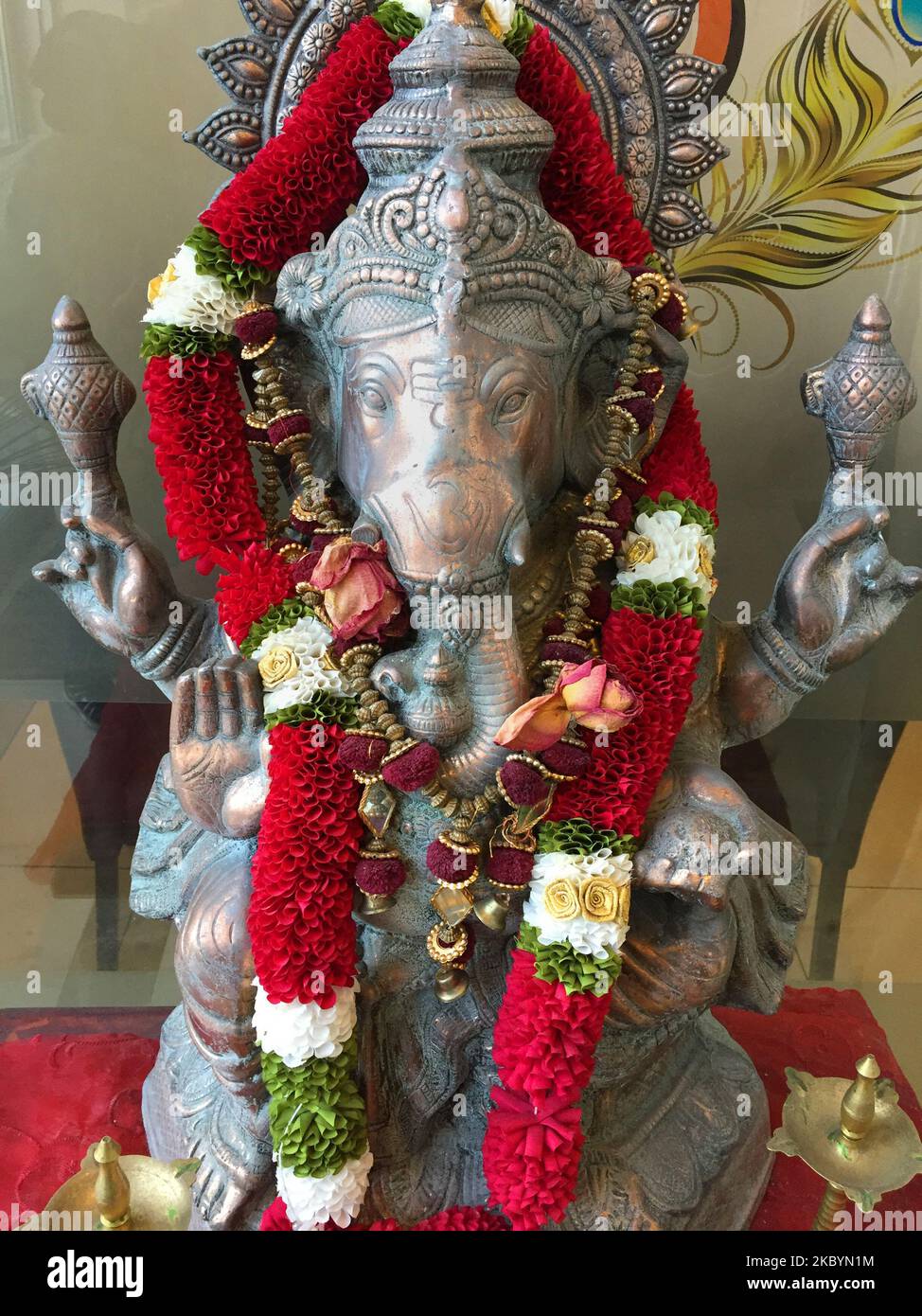 Brass idol of Lord Ganesha (Lord Ganesh) at the entrance of a Hindu