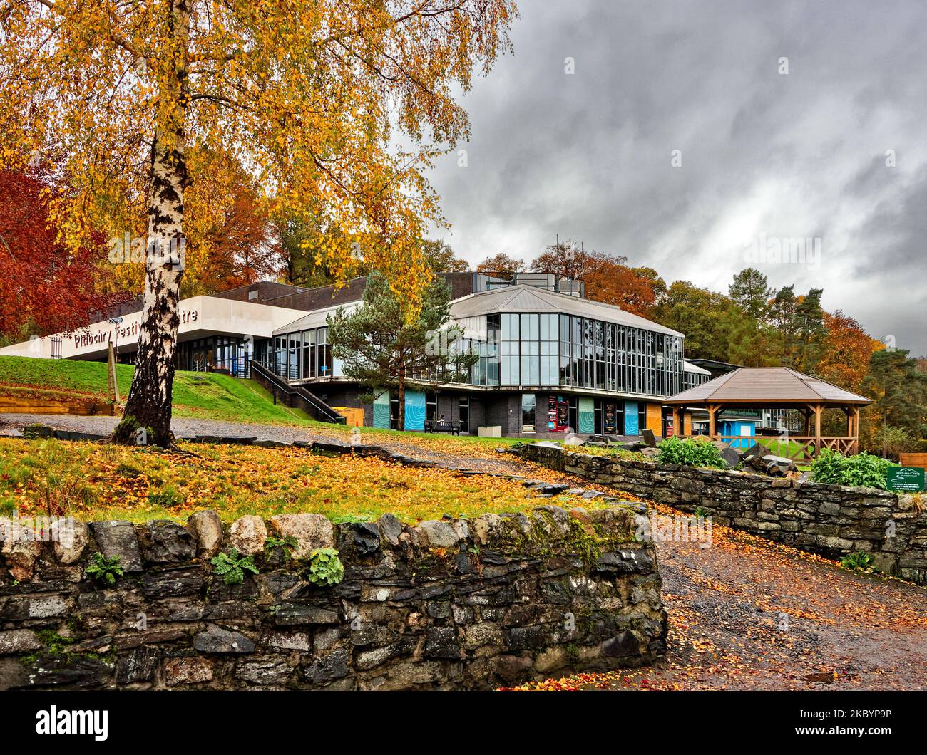 Pitlochry Perthshire Scotland the Festival Theatre building surrounded by trees in autumnal colours Stock Photo