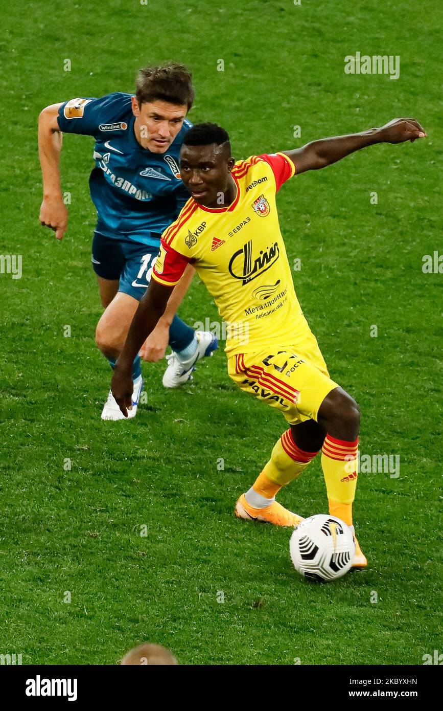 Yuri Zhirkov (L) of Zenit Saint Petersburg and Kings Kangwa of Arsenal Tula in action during the Russian Premier League match between FC Zenit Saint Petersburg and FC Arsenal Tula on September 14, 2020 at Gazprom Arena in Saint Petersburg, Russia. (Photo by Mike Kireev/NurPhoto) Stock Photo