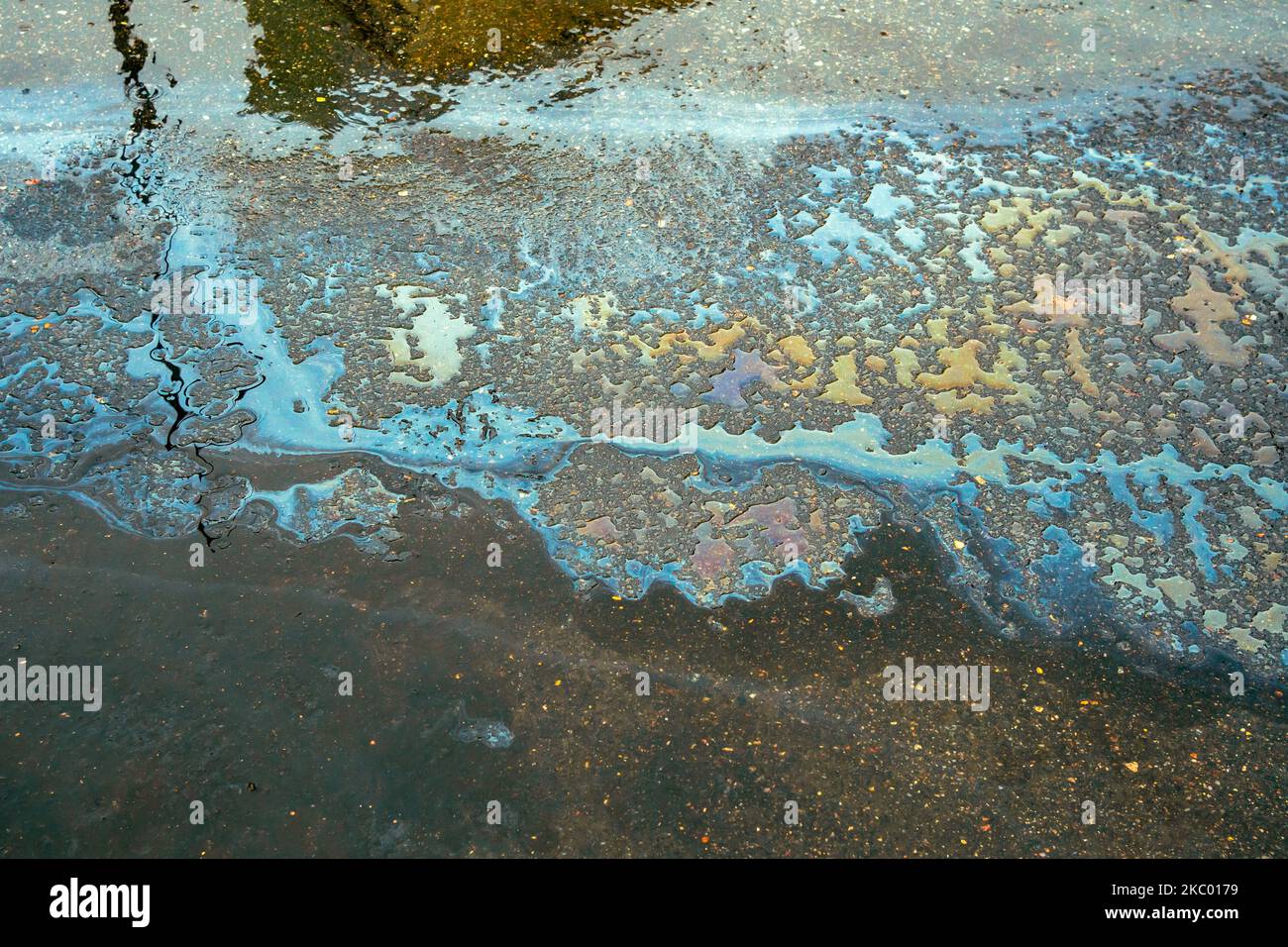 Colorful oil spill on wet pavement Stock Photo Alamy