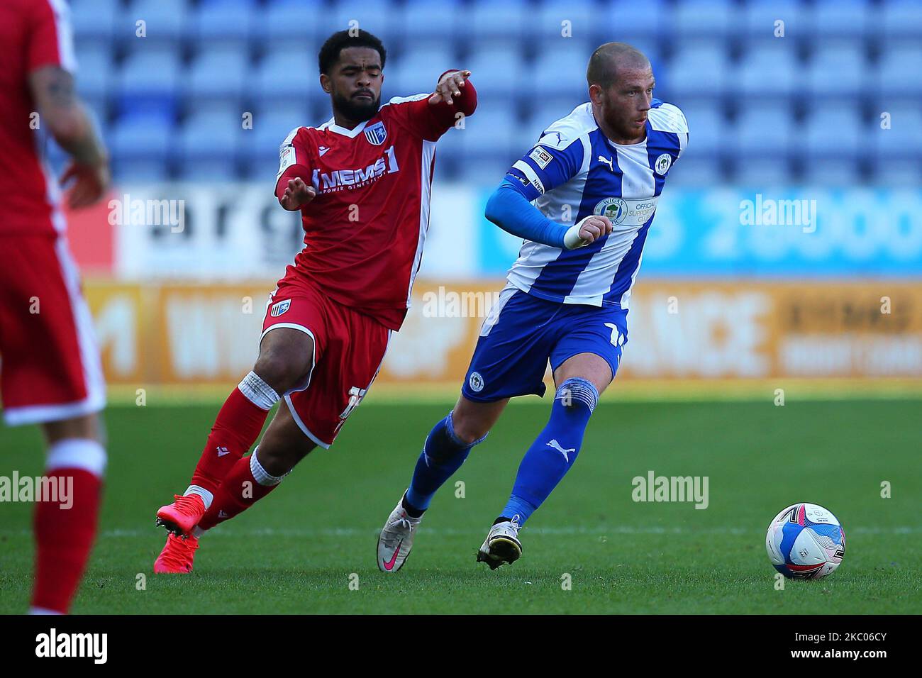 Wigans Joe Garner gets passed Gillinghams Trae Coyle during the Sky Bet League 1 match between Wigan Athletic and Gillingham at the DW Stadium, Wigan, England, on September 19, 2020. (Photo by Chris Donnelly/MI News/NurPhoto) Stock Photo