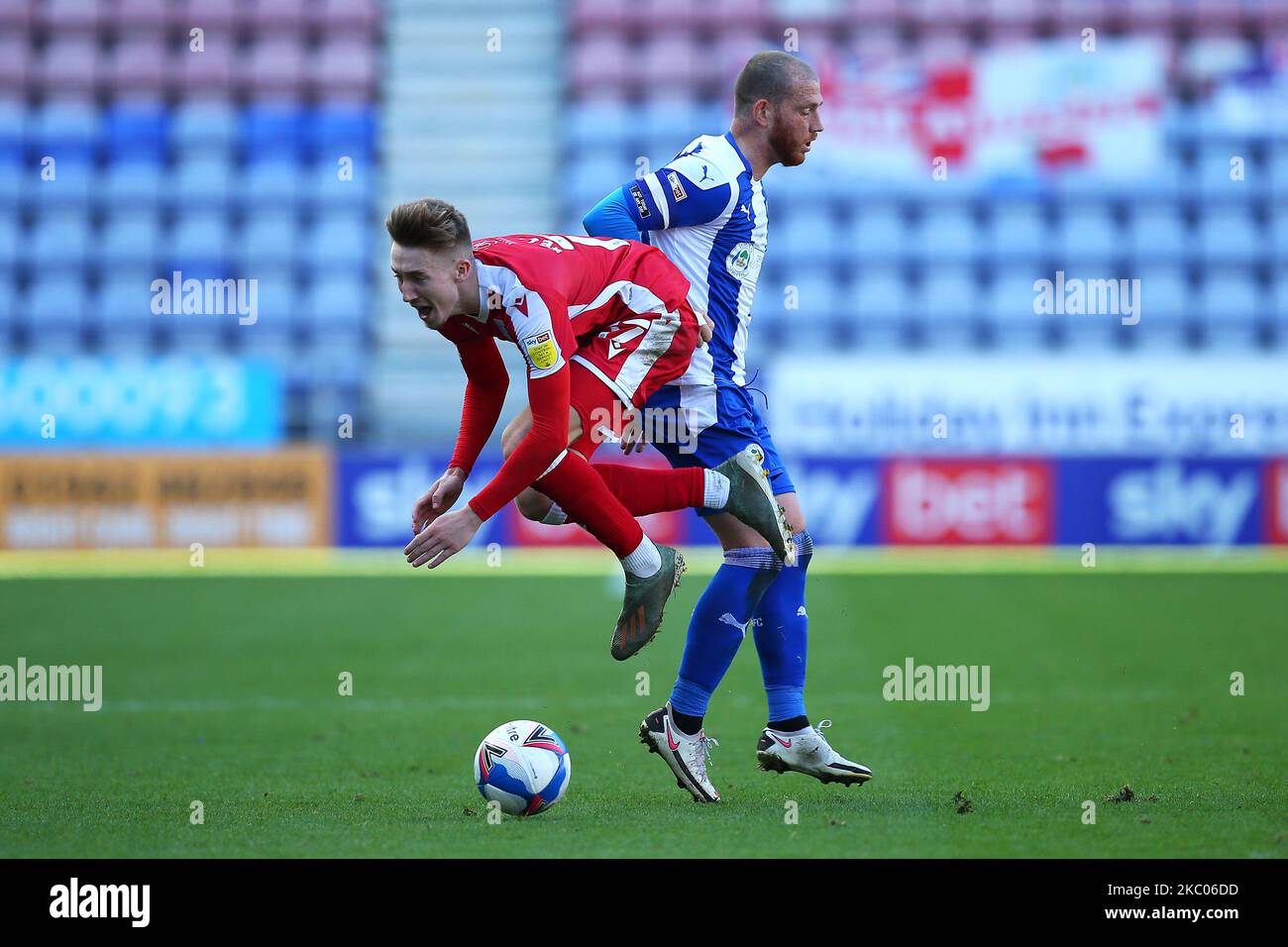 Wigans Joe Garner clashes with Gillinghams Josh Eccles during the Sky Bet League 1 match between Wigan Athletic and Gillingham at the DW Stadium, Wigan, England, on September 19, 2020. (Photo by Chris Donnelly/MI News/NurPhoto) Stock Photo