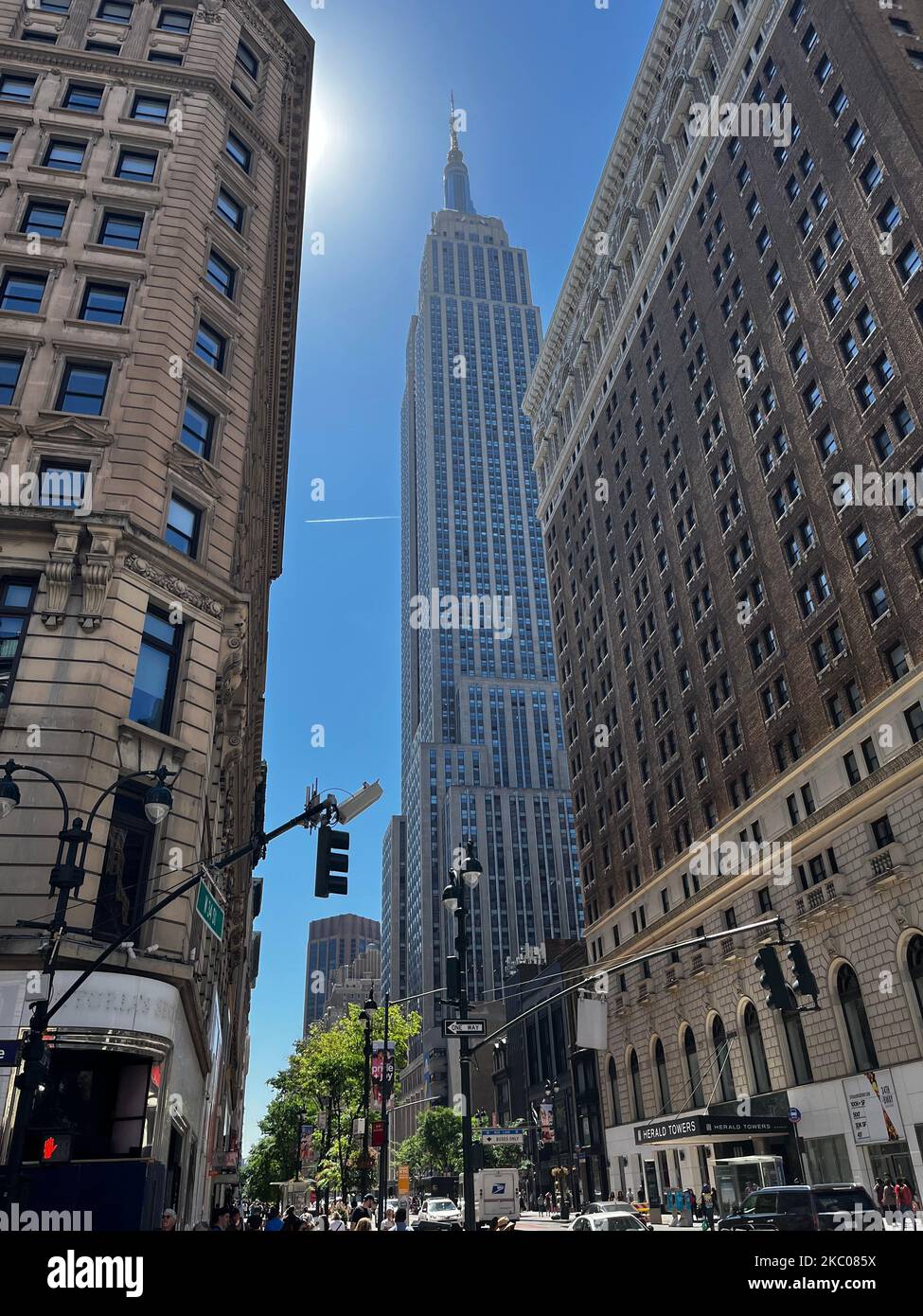 Street view from New York City with the Empire State Building in the ...