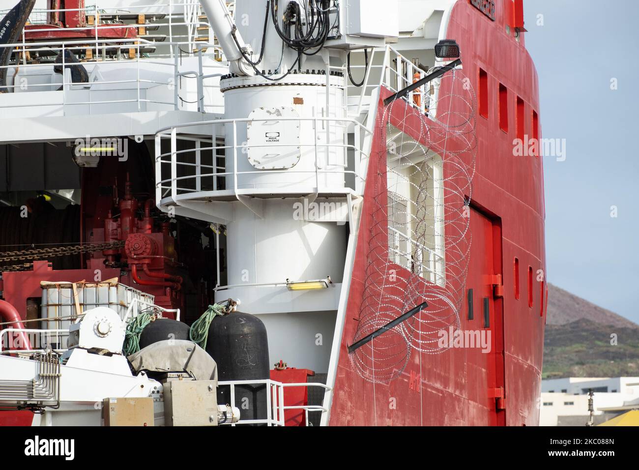 Skandi Iceman, tug, offshore supply ship having razor/barbed wire ...
