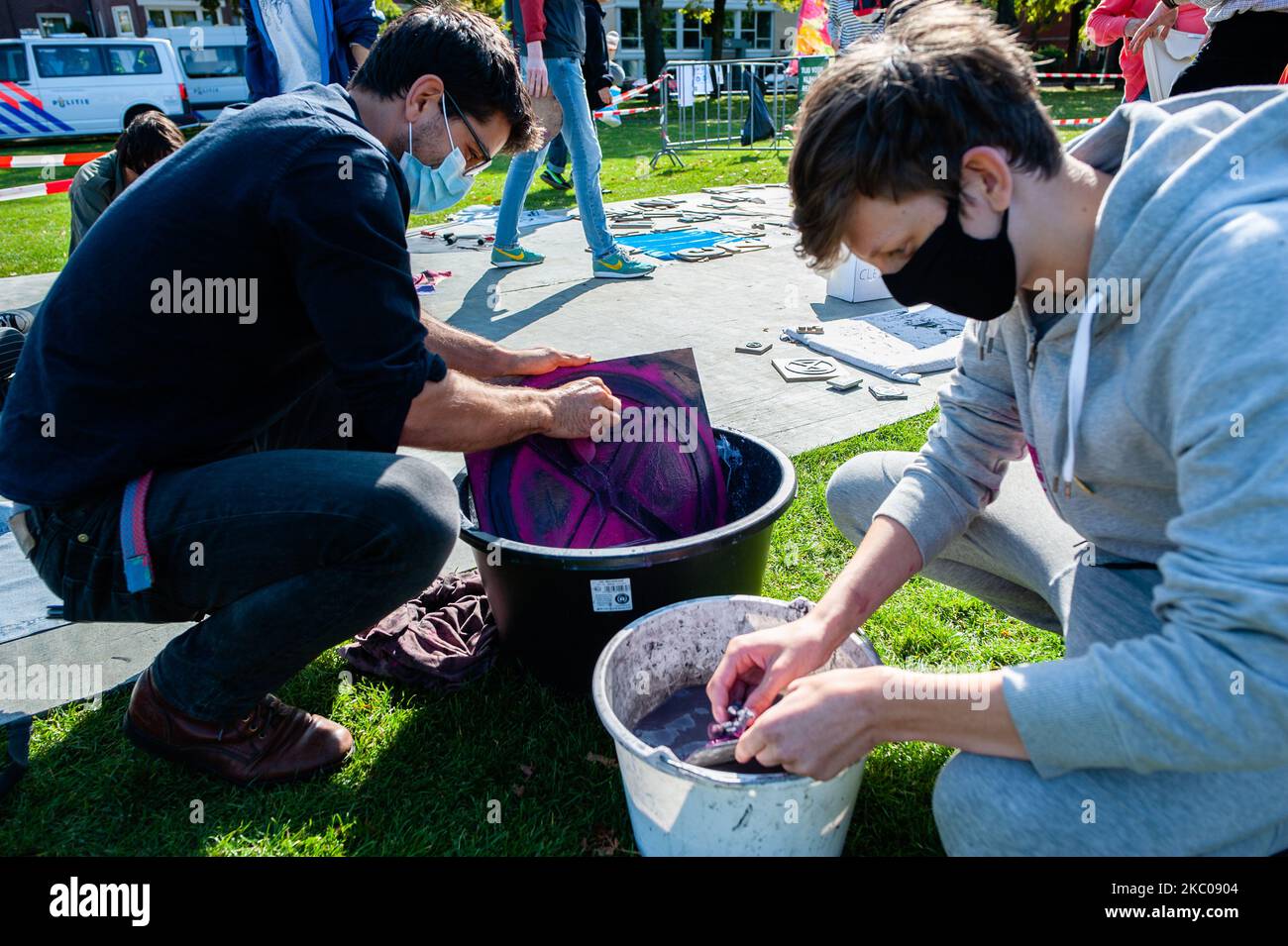 XR activists are doing some serigraphs with the XR logo, during the Extinction Rebellion camp located at the Museumplein, in Amsterdam, on September 19th, 2020. (Photo by Romy Arroyo Fernandez/NurPhoto) Stock Photo