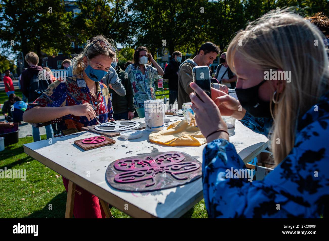 XR activists are doing some serigraphs with the XR logo, during the Extinction Rebellion camp located at the Museumplein, in Amsterdam, on September 19th, 2020. (Photo by Romy Arroyo Fernandez/NurPhoto) Stock Photo