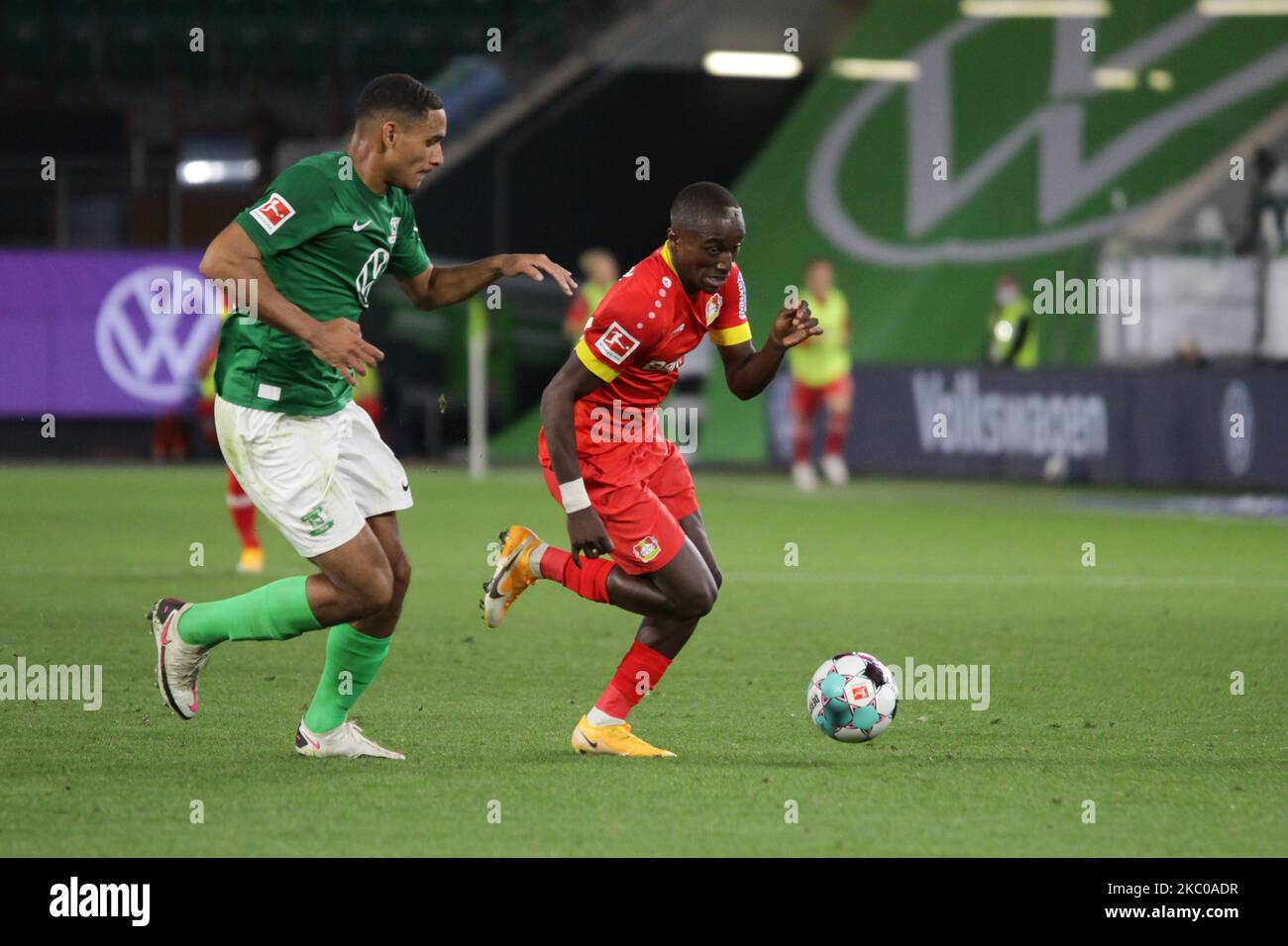 Maxence Lacroix of VfL Wolfsburg and Moussa Diaby of Bayer 04 Leverkusen runs for the ball during the Bundesliga match between VfL Wolfsburg and Bayer 04 Leverkusen at Volkswagen Arena on September 20, 2020 in Wolfsburg, Germany. (Photo by Peter Niedung/NurPhoto) Stock Photo
