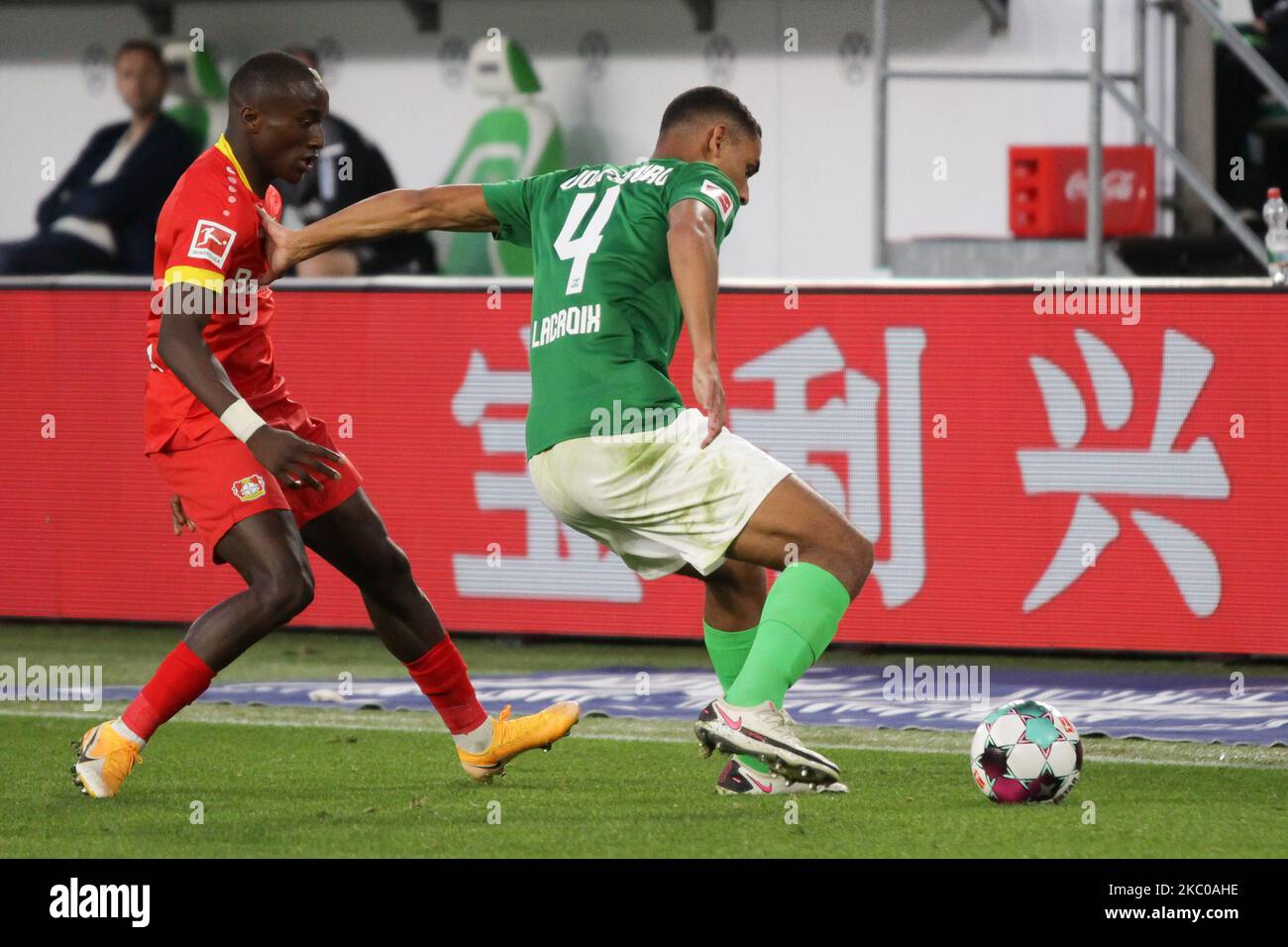 Moussa Diaby of Bayer 04 Leverkusen and Maxence Lacroix of VfL Wolfsburg battle for the ball during the Bundesliga match between VfL Wolfsburg and Bayer 04 Leverkusen at Volkswagen Arena on September 20, 2020 in Wolfsburg, Germany. (Photo by Peter Niedung/NurPhoto) Stock Photo