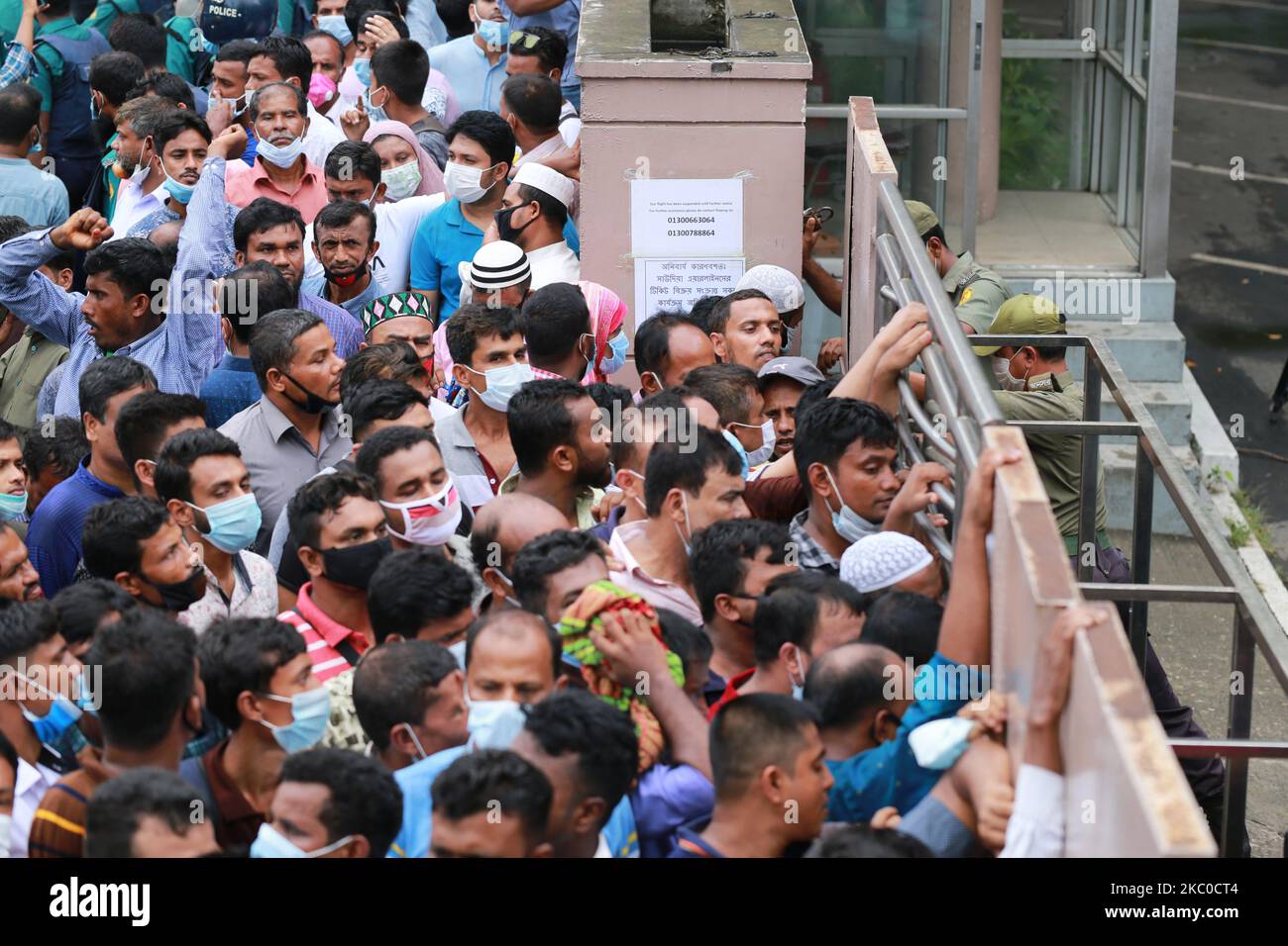 Bangladeshi migrant workers who work in Saudi Arabia protest in front of the Saudi Arabian Airlines office at Pan Pacific Sonargaon hotel demanding air tickets to go back their workstations, In Dhaka, Bangladesh on September 22, 2020. (Photo by Rehman Asad/NurPhoto) Stock Photo