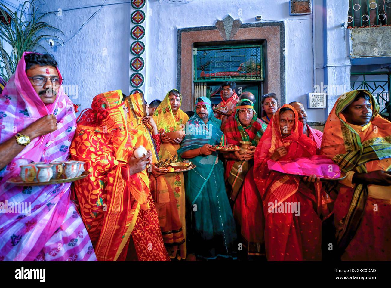 Hindu men seen dressed up as women (saree) to make the final worship before the immersion of Hindu goddess jagadhatri as per Traditional myth & culture. The 230-year-old jagadhatri Puja with its distinctive 'devi-baran' - last day Puja ritual where a man dresses up as a woman for the sake of good health, a suitable life partner, and the well-being of their family as per traditional myth & culture. On the same day the immersion of the goddess takes place. (Photo by Avishek Das / SOPA Images/Sipa USA) Stock Photo