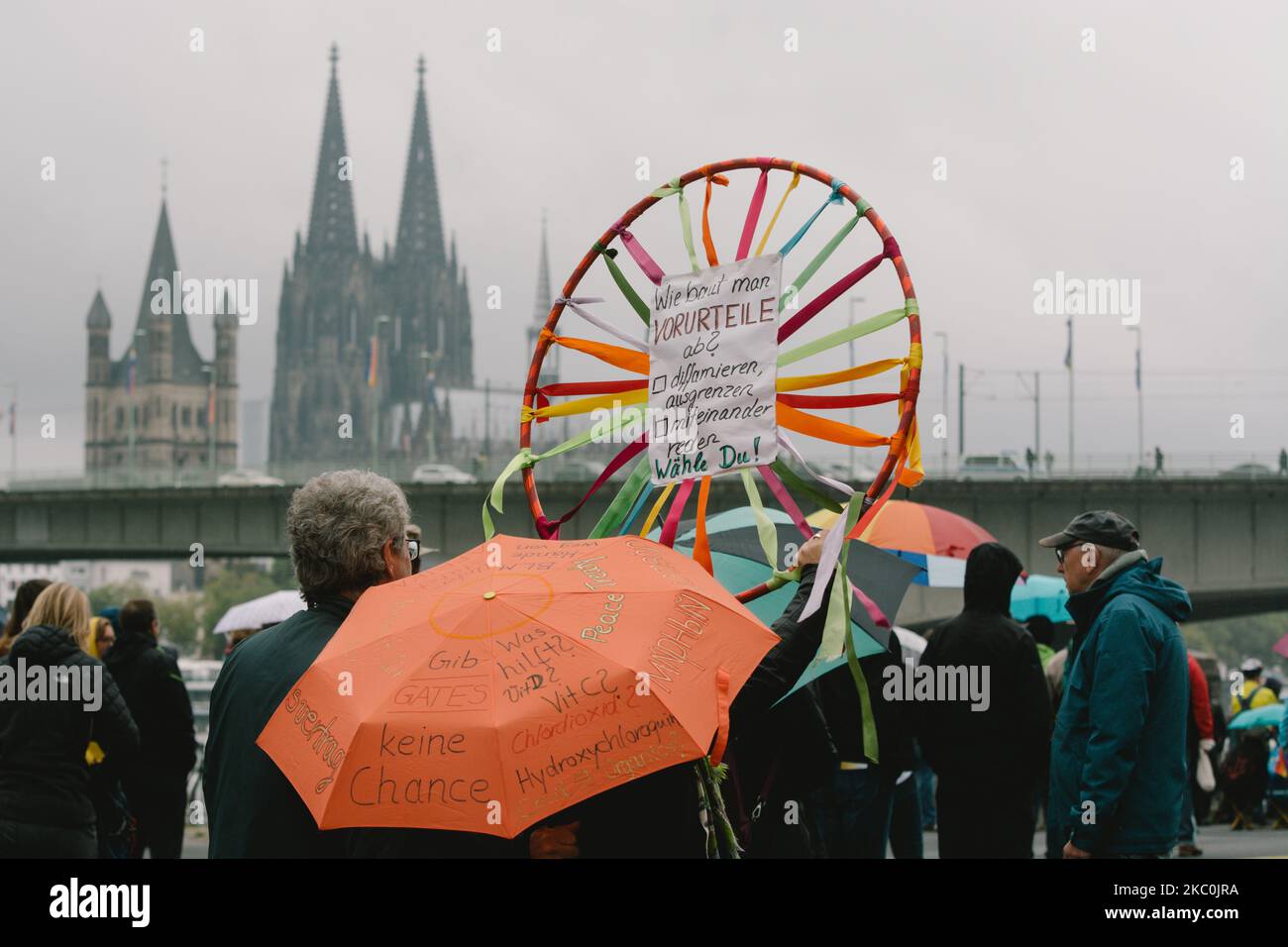 A wing spinner with a message ''how to build discrimination, slander, communication, you choose'' is seen during the coronavirus skeptics rally in Cologne, Germany, on September 26, 2020. (Photo by Ying Tang/NurPhoto) Stock Photo