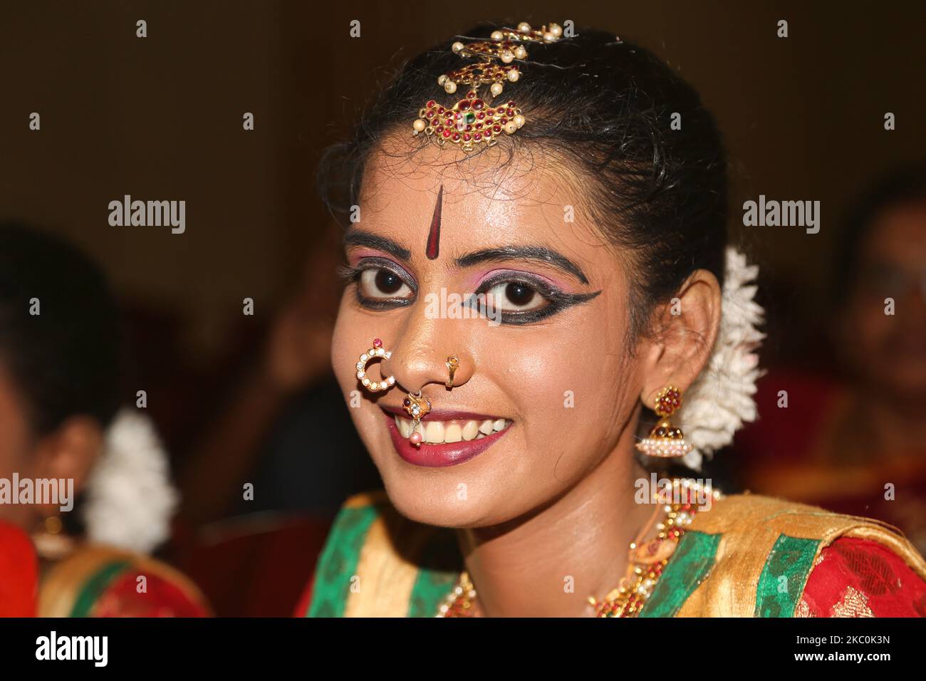 Tamil girl dressed in traditional attire waits to perform a Bharathnatyam dance during a special cultural program featuring Tamil children who were orphaned during the civil war in Jaffna, Sri Lanka, on August 12, 2017. This is just one of the many reminders of the deep scars caused during the 26-year long civil war between the Sri Lankan Army and the LTTE (Liberation Tigers of Tamil Eelam). The United Nations estimates about 40,000 people were killed during the war. (Photo by Creative Touch Imaging Ltd./NurPhoto) Stock Photo