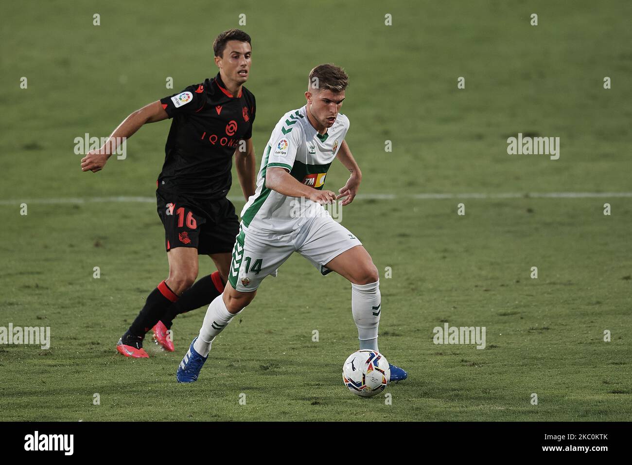 Raul Guti of Elche and Ander Guevara of Real Sociedad compete for the ball during the La Liga Santader match between Elche CF and Real Sociedad at Estadio Martinez Valero on September 27, 2020 in Elche, Spain. (Photo by Jose Breton/Pics Action/NurPhoto) Stock Photo