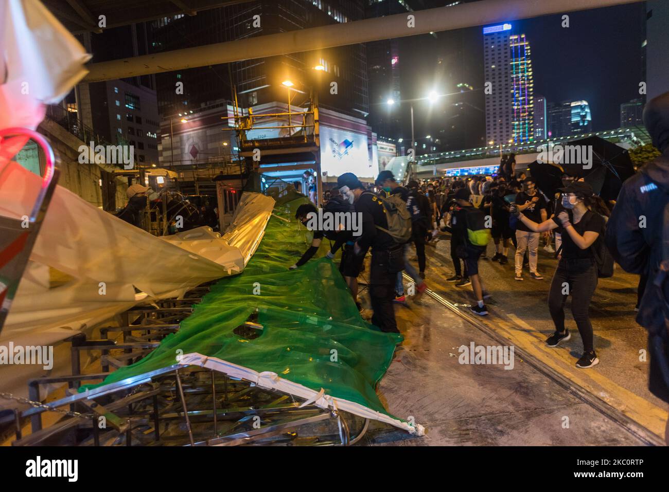 Protesters break into a construction site to get materials to block Harcourt road in Central Hong Kong, China, on 28 Sep 2019. (Photo by Marc Fernandes/NurPhoto) Stock Photo